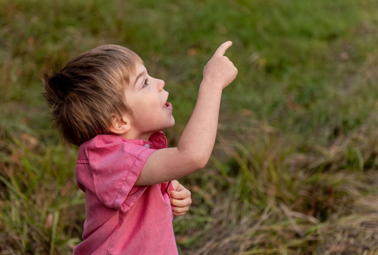 young boy in awe of an airplane overhead Salem, OR