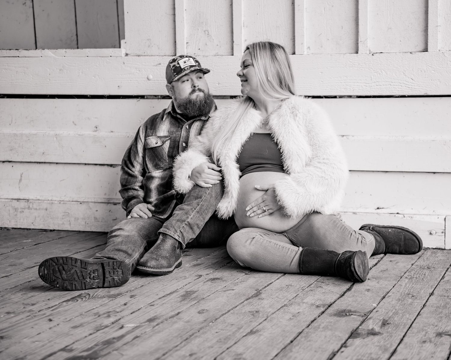 Mom and dad holding sonogram photo posed for a maternity session located in Stayton, OR