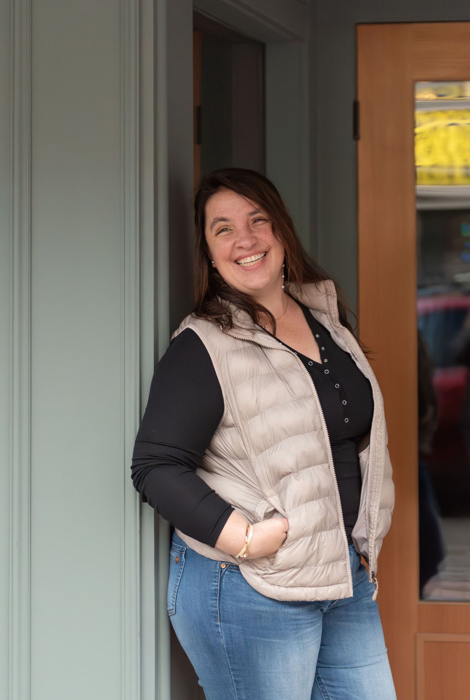 Woman Leaning on a wall near a storefront for a branding session, Downtown Salem, OR