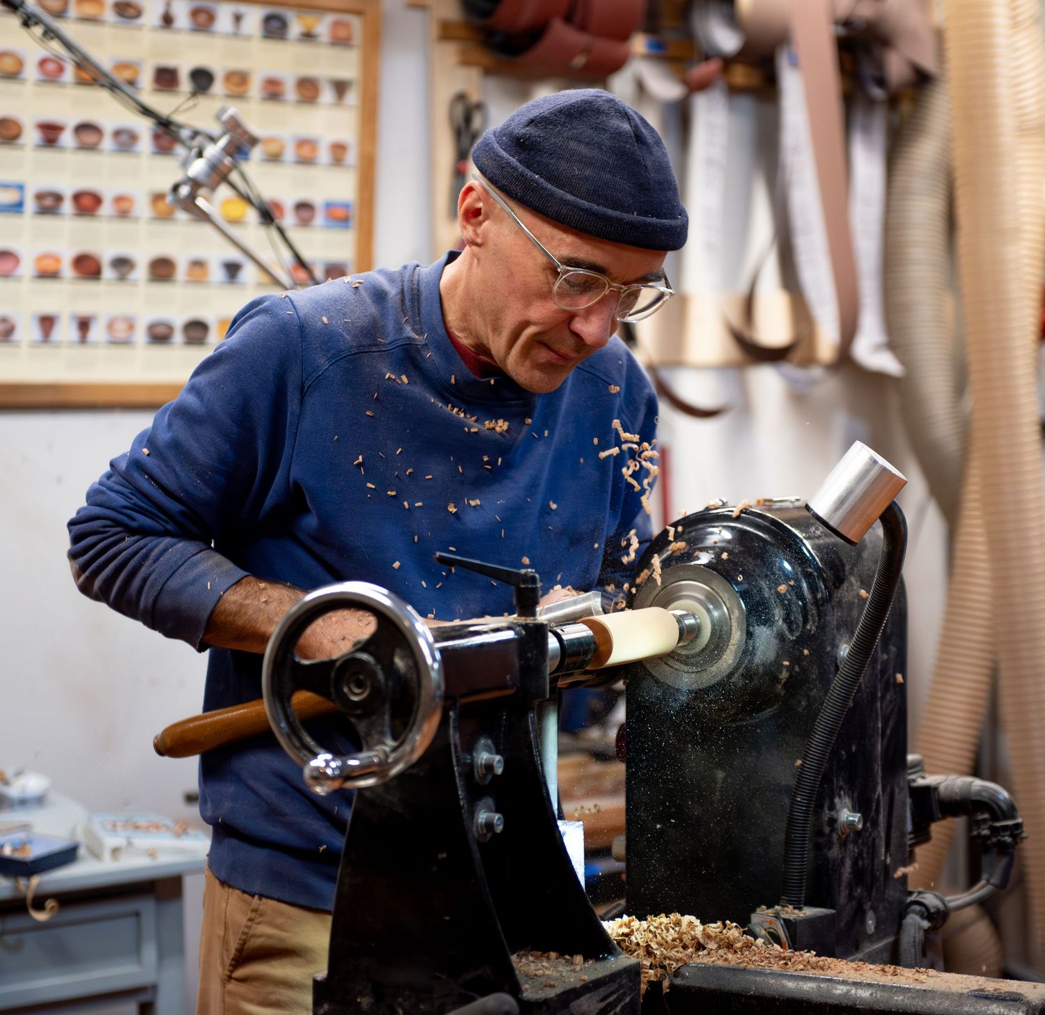 world renowned wood turner turning wood in a wood shop with wood working tools and lathe located in Turner, OR
