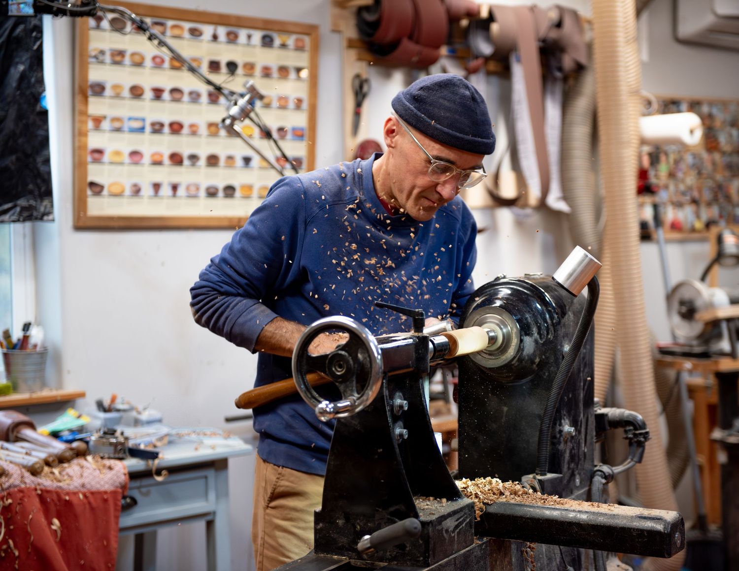 world renowned wood turner turning wood in a wood shop with wood working tools and lathe located in Turner, OR
