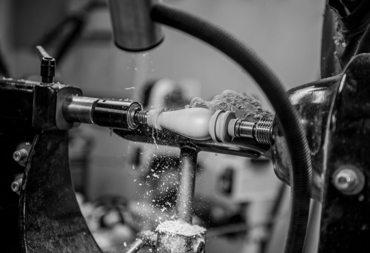 world renowned wood turner turning wood in a wood shop with wood working tools and lathe located in Turner, OR