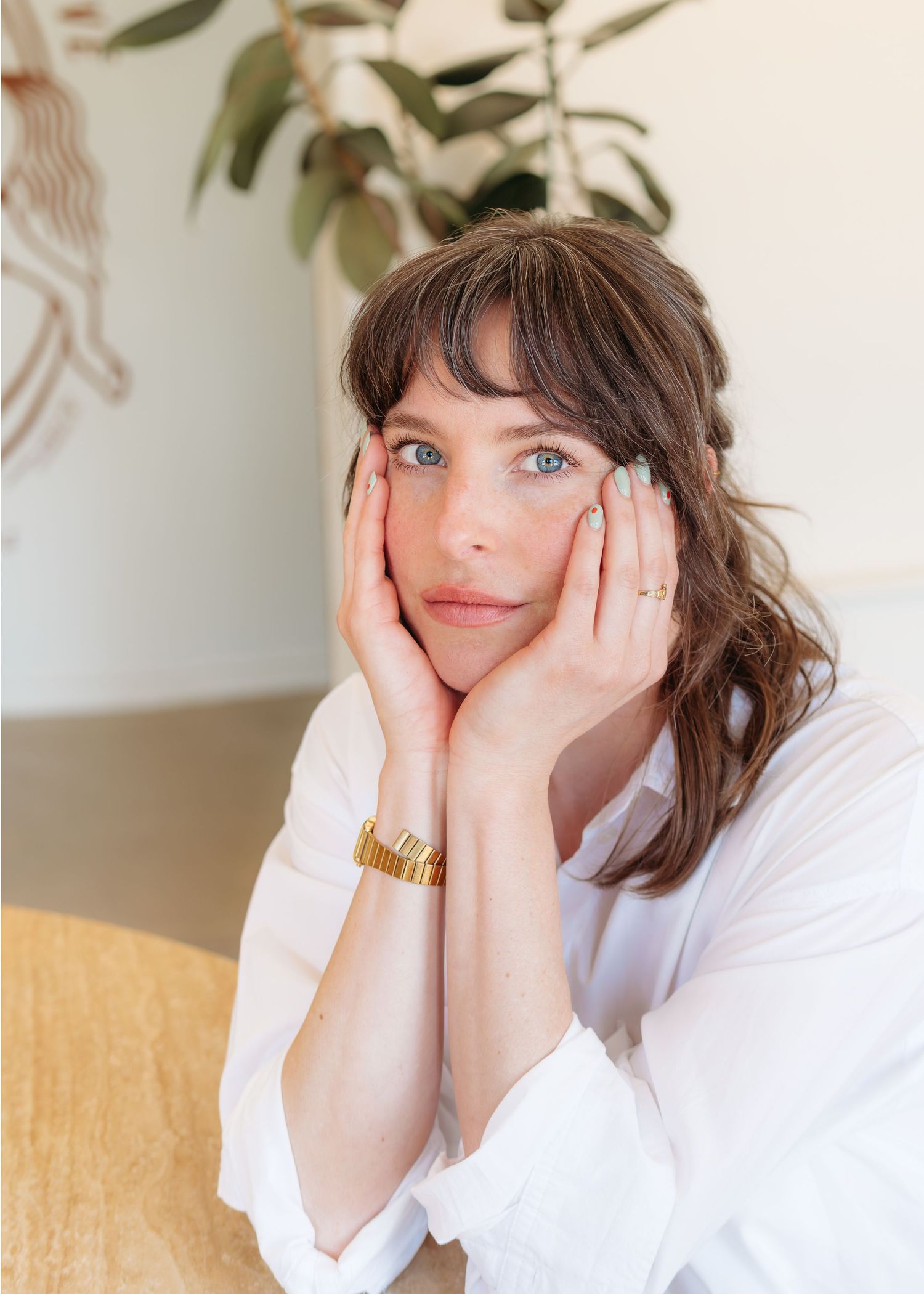 A close-up headshot of a woman showcases a clean and bright aesthetic in a local beauty business.
