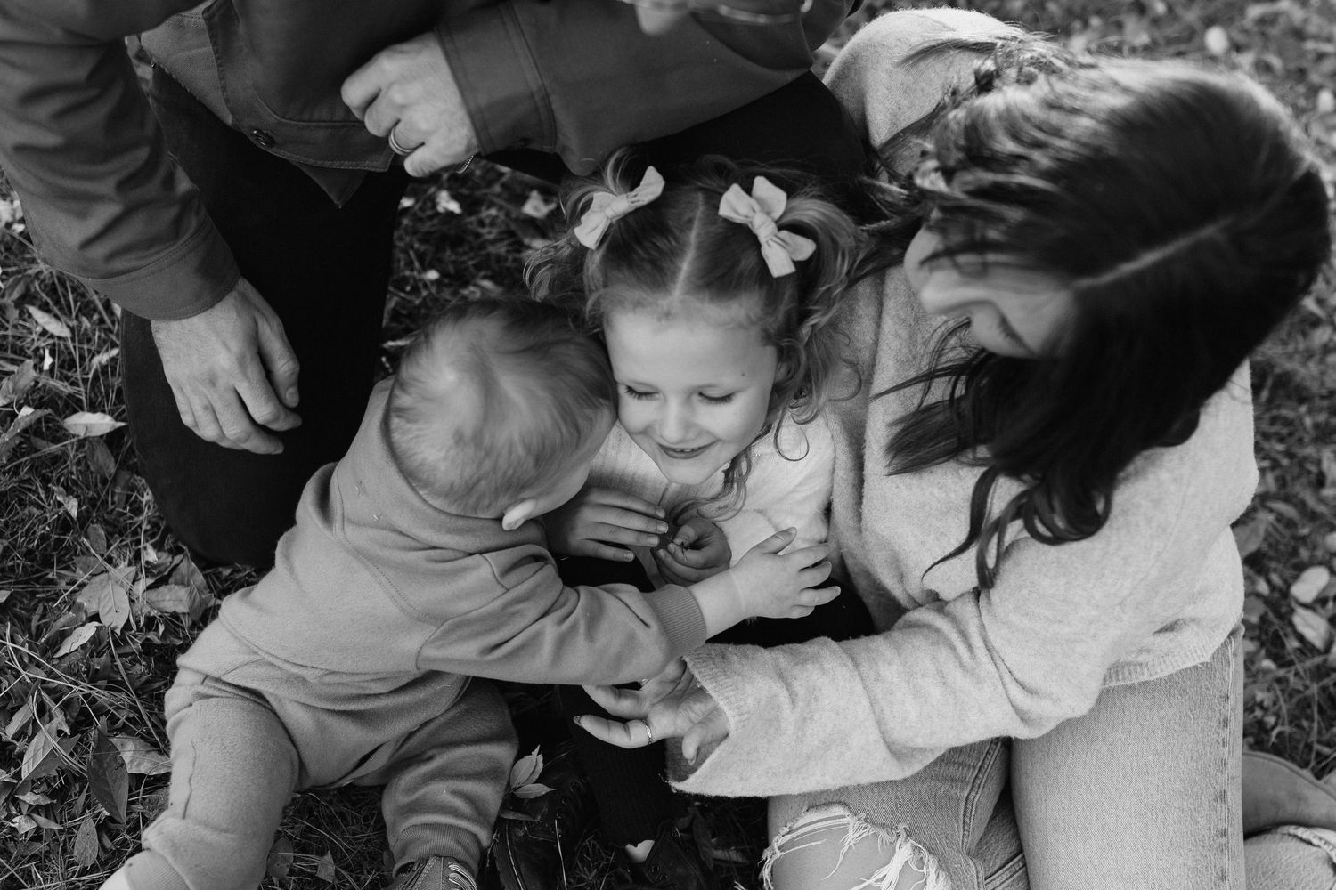 Black and white intimate family photography series outdoors.