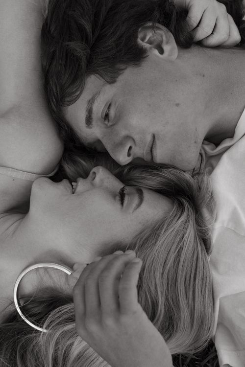 Intimate black and white close-up portrait of couple.