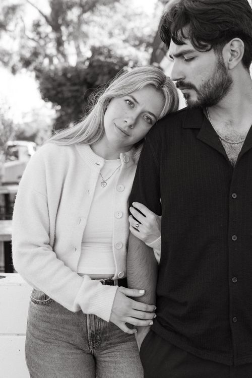 Intimate black and white portrait of couple in casual attire.