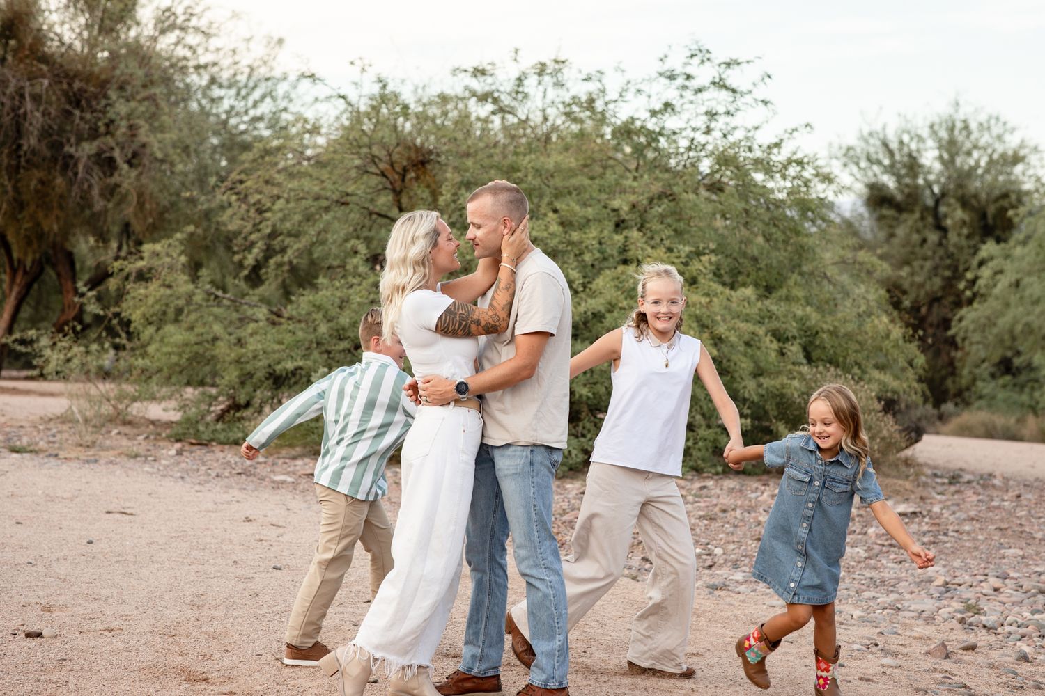 Candid family moments captured at sunset in a desert landscape with author Al Carraway and Ben Carraway.
