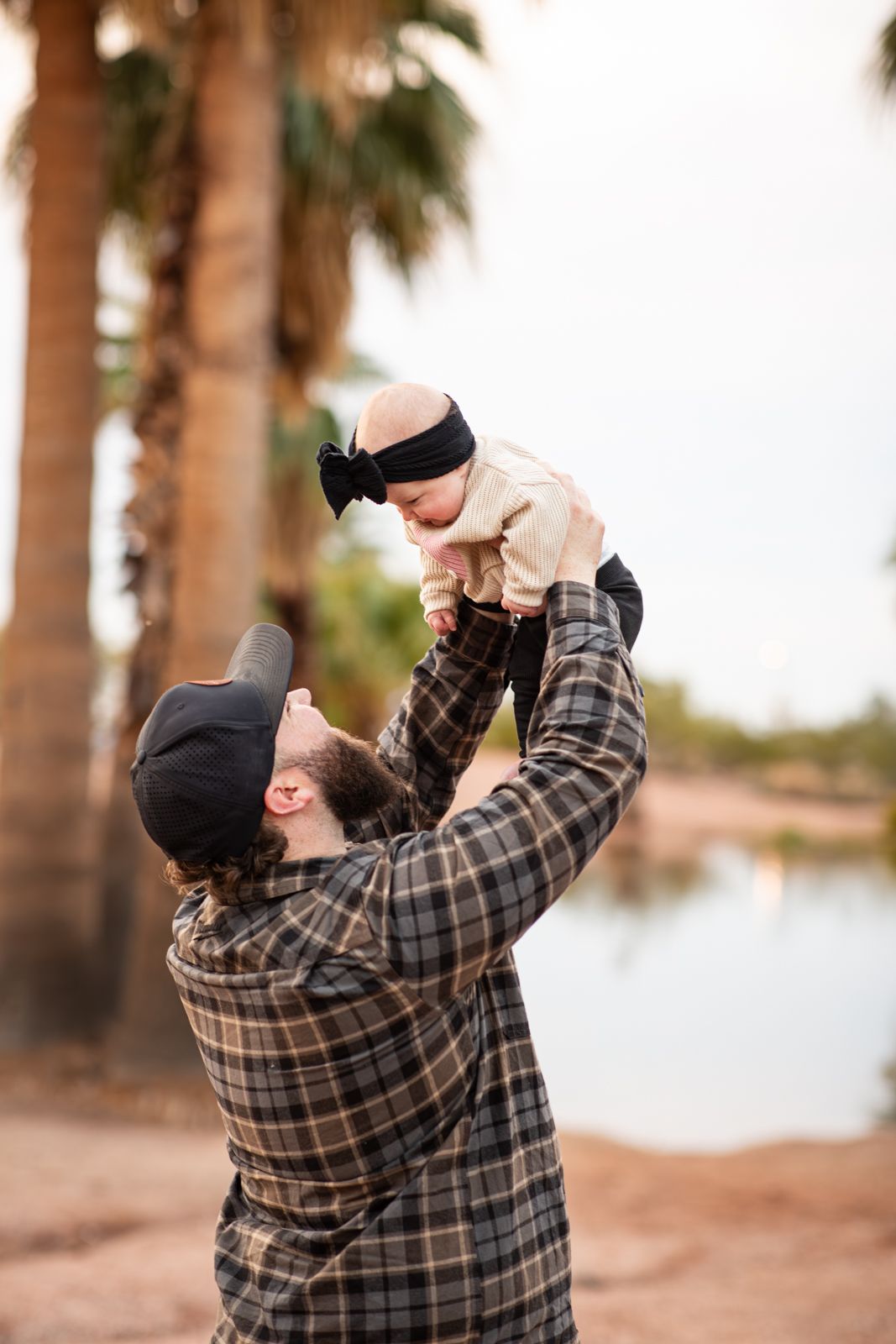 A playful family photoshoot sequence under palm trees in a desert setting at sunset in Papago Park in Phoenix, AZ.