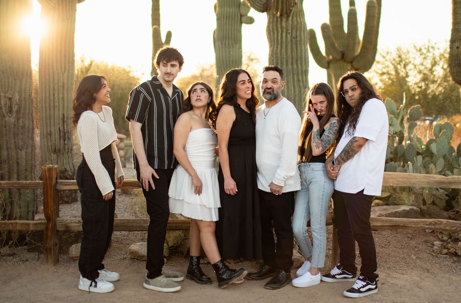 A series of candid outdoor photos showing people posing in front of saguaro cacti during golden hour in the desert.