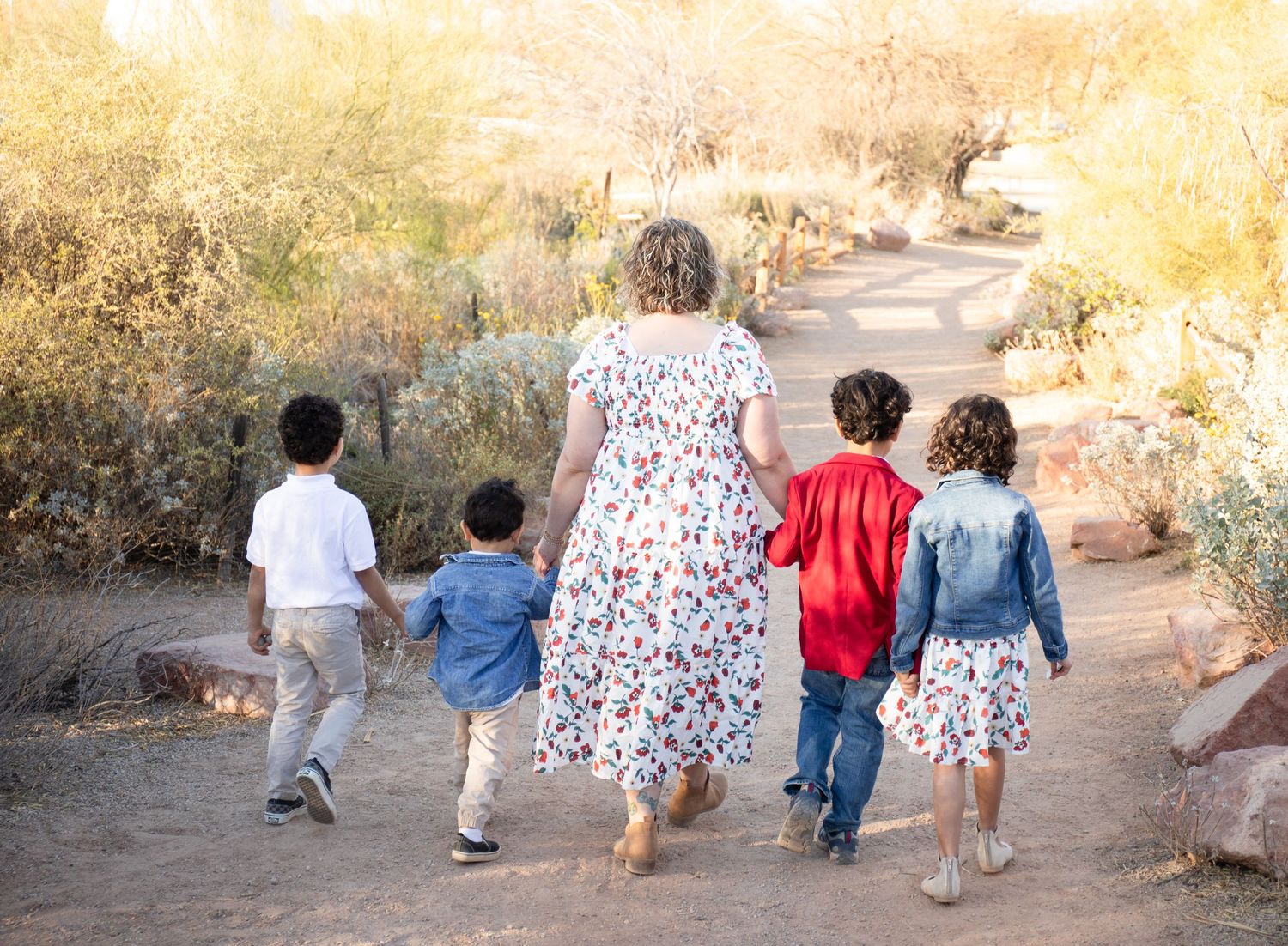 A series of candid photos showing people sitting and walking together on a dirt path during golden hour at the Riparian Preserve in Gilbert