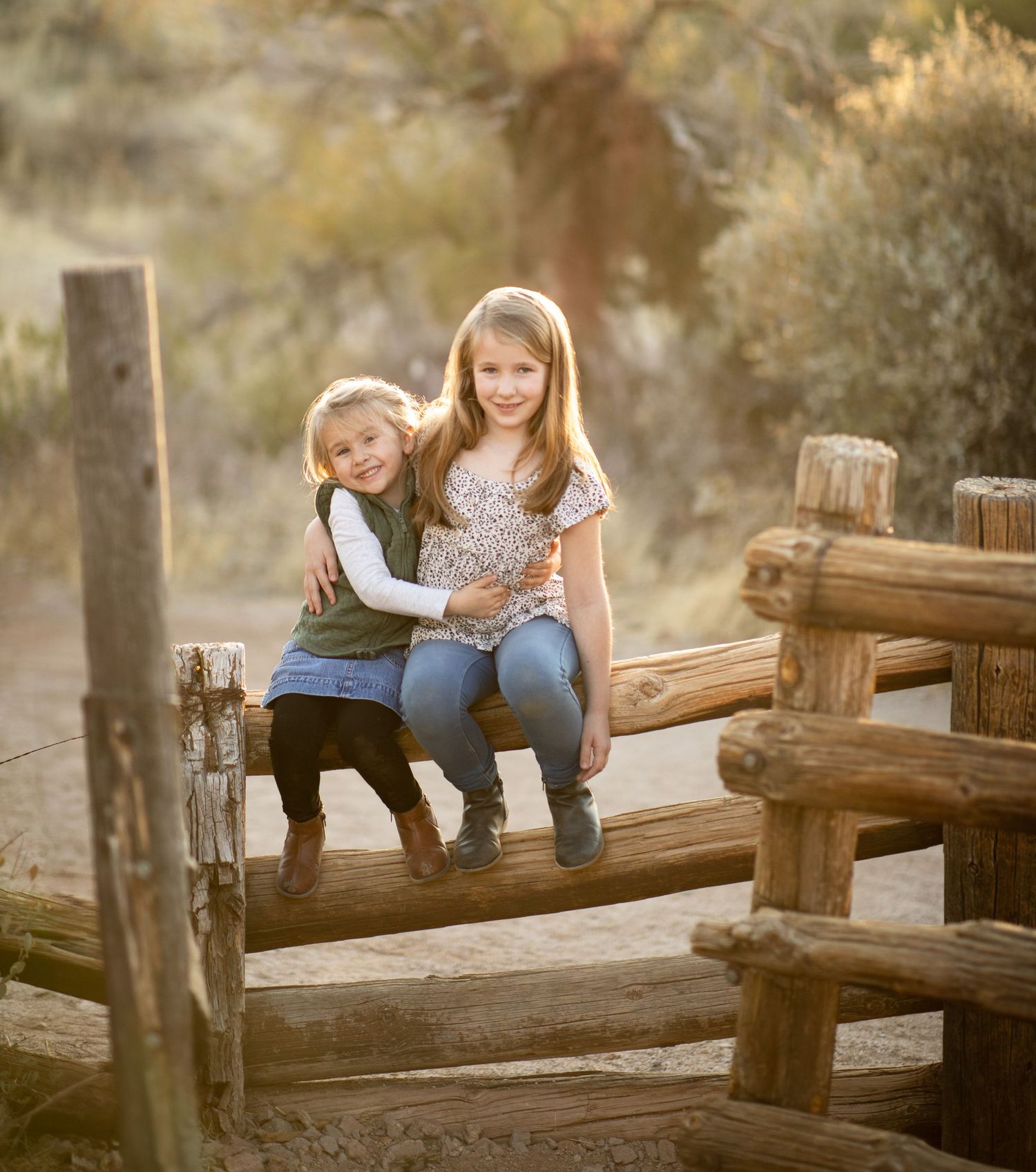 A rustic wooden bridge in a natural outdoor setting creates a charming backdrop for a relaxed photo session at Lost Dutchman state park.