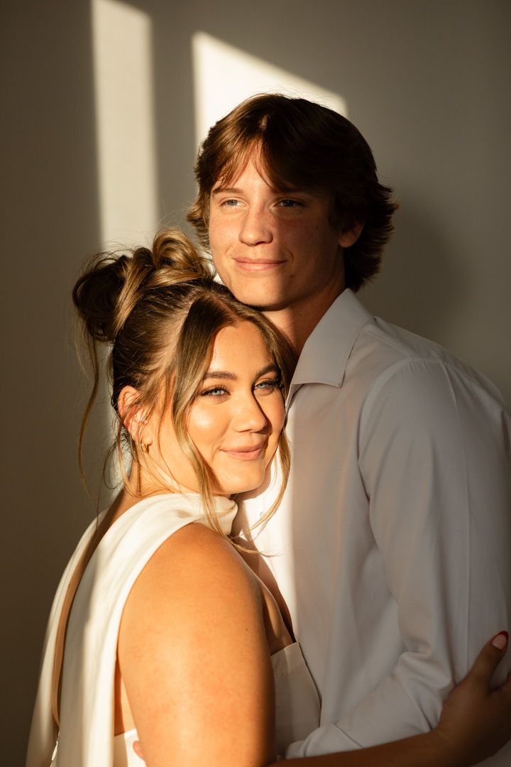 Artistic wedding portraits with dramatic lighting and shadows.