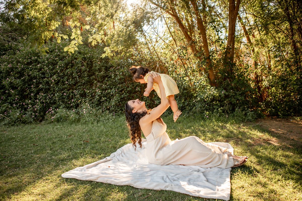 A mom and daughter playing at The Meadow in Mesa, Arizona.