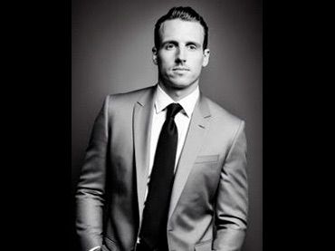 Black and white professional headshots in formal business attire.