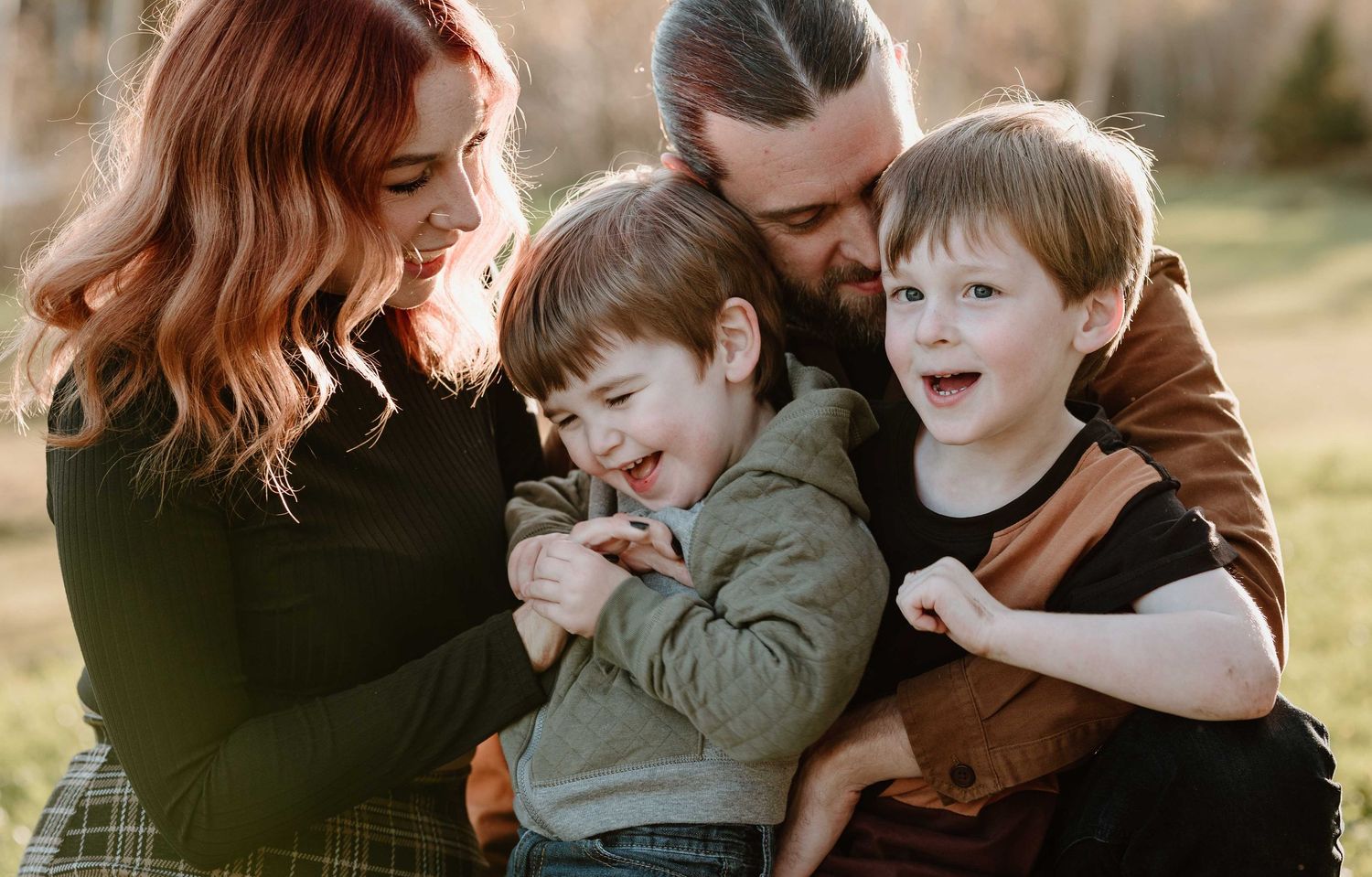 Intimate family photo session showing close embraces and joyful interactions.