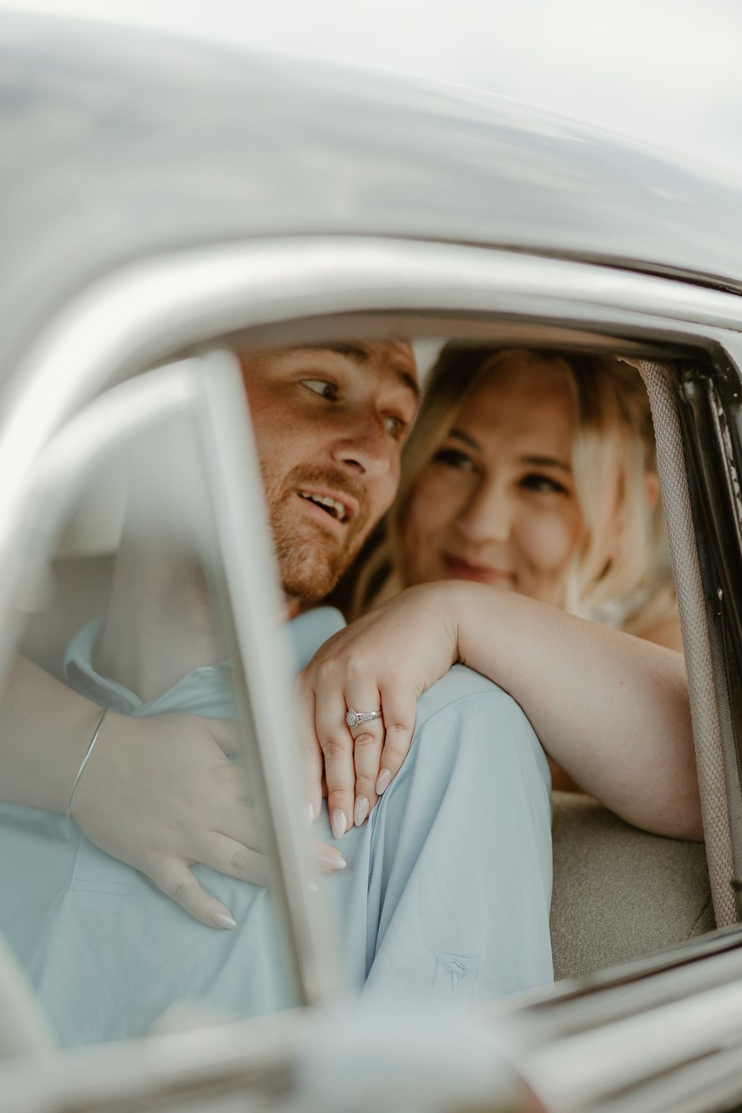 Close-up shots inside a classic car showing tender moments and genuine emotions.