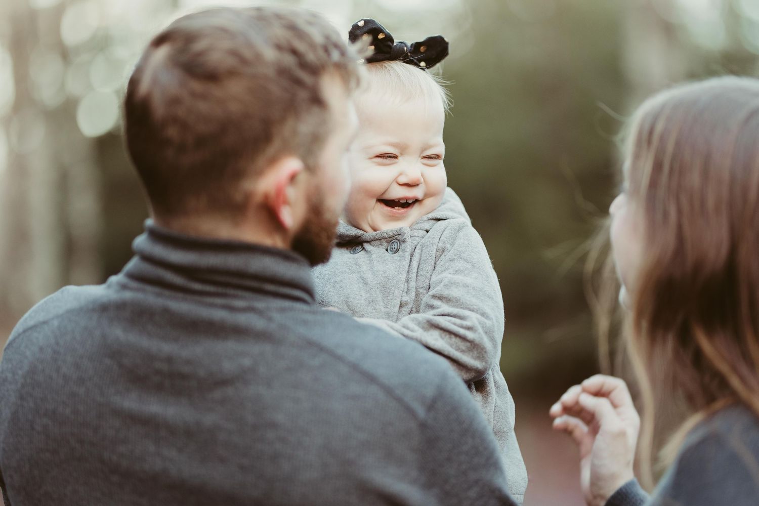 Candid family photo session outdoors captured in a collage of intimate moments and expressions.