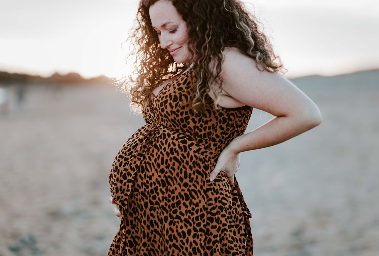 Multiple shots of beachside maternity session featuring leopard print dress and natural lighting.