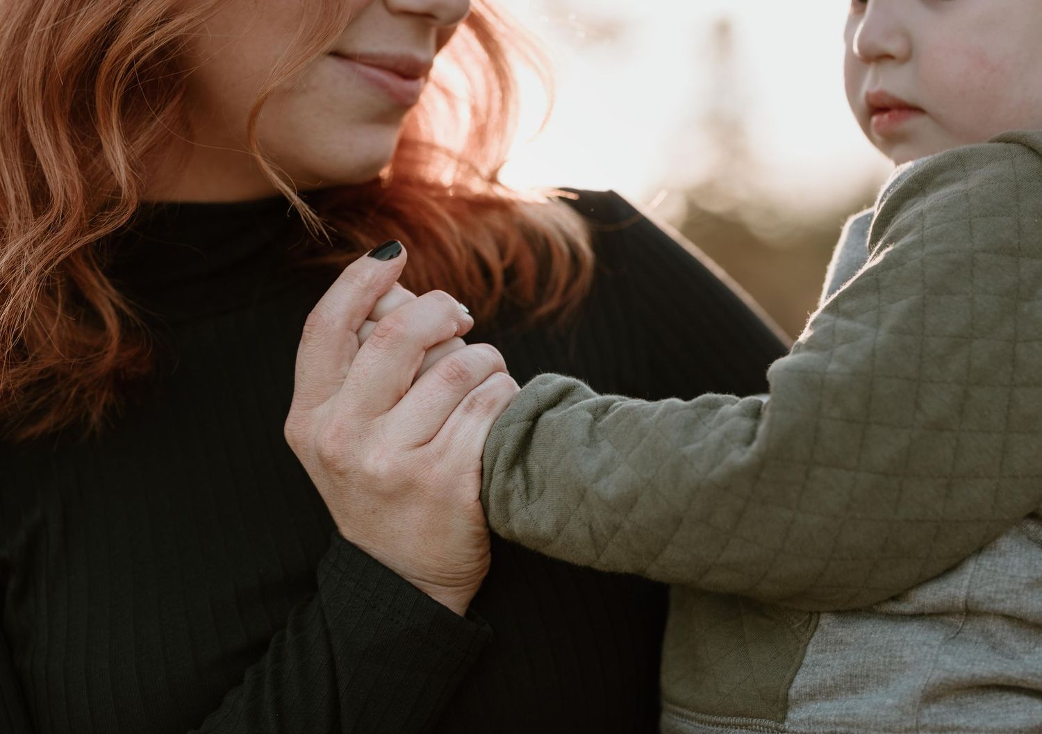 Close-up series of tender family interactions in natural outdoor setting.