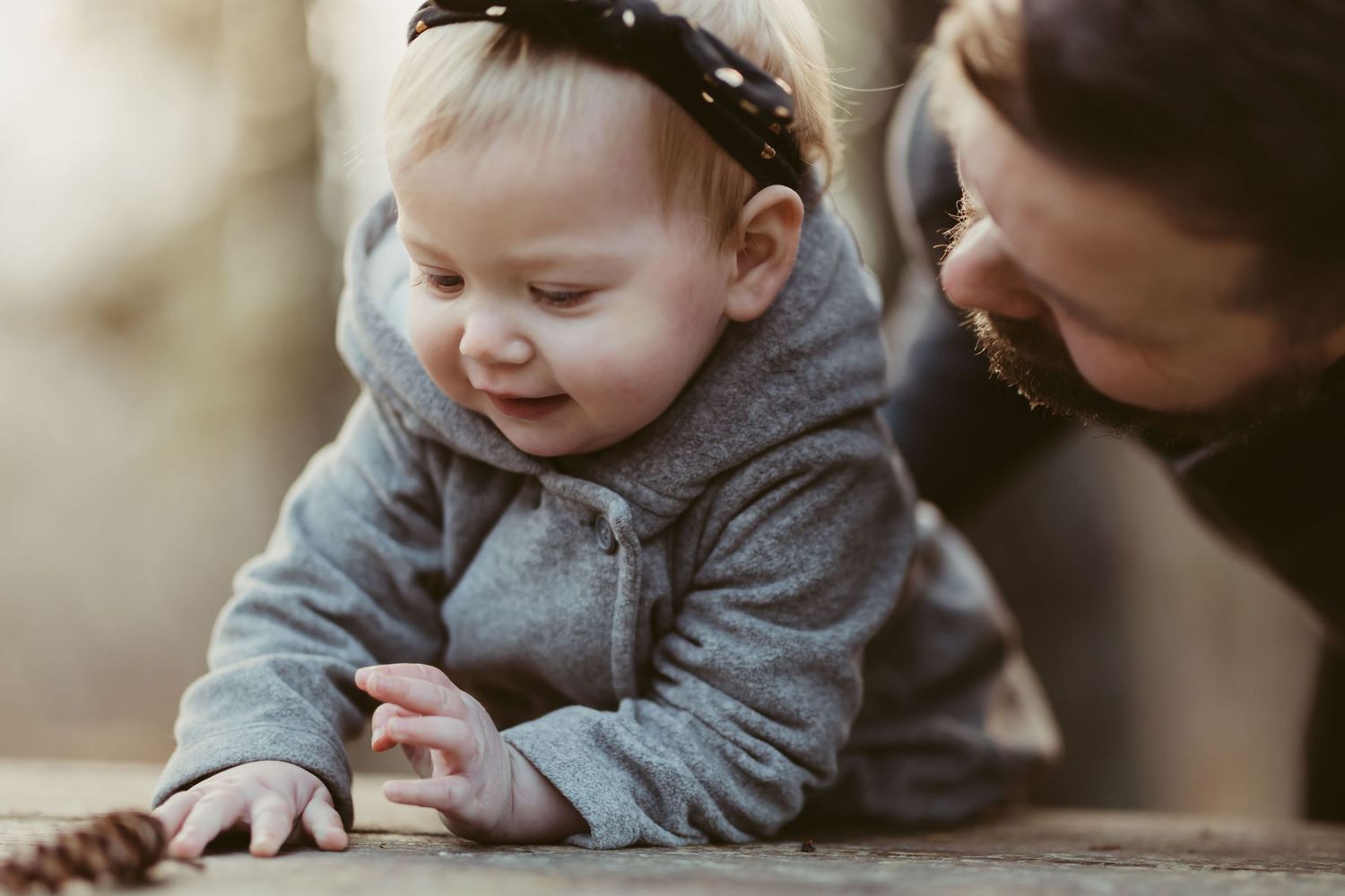 Sweet collection of tender moments between parent and child in matching grey outfits.