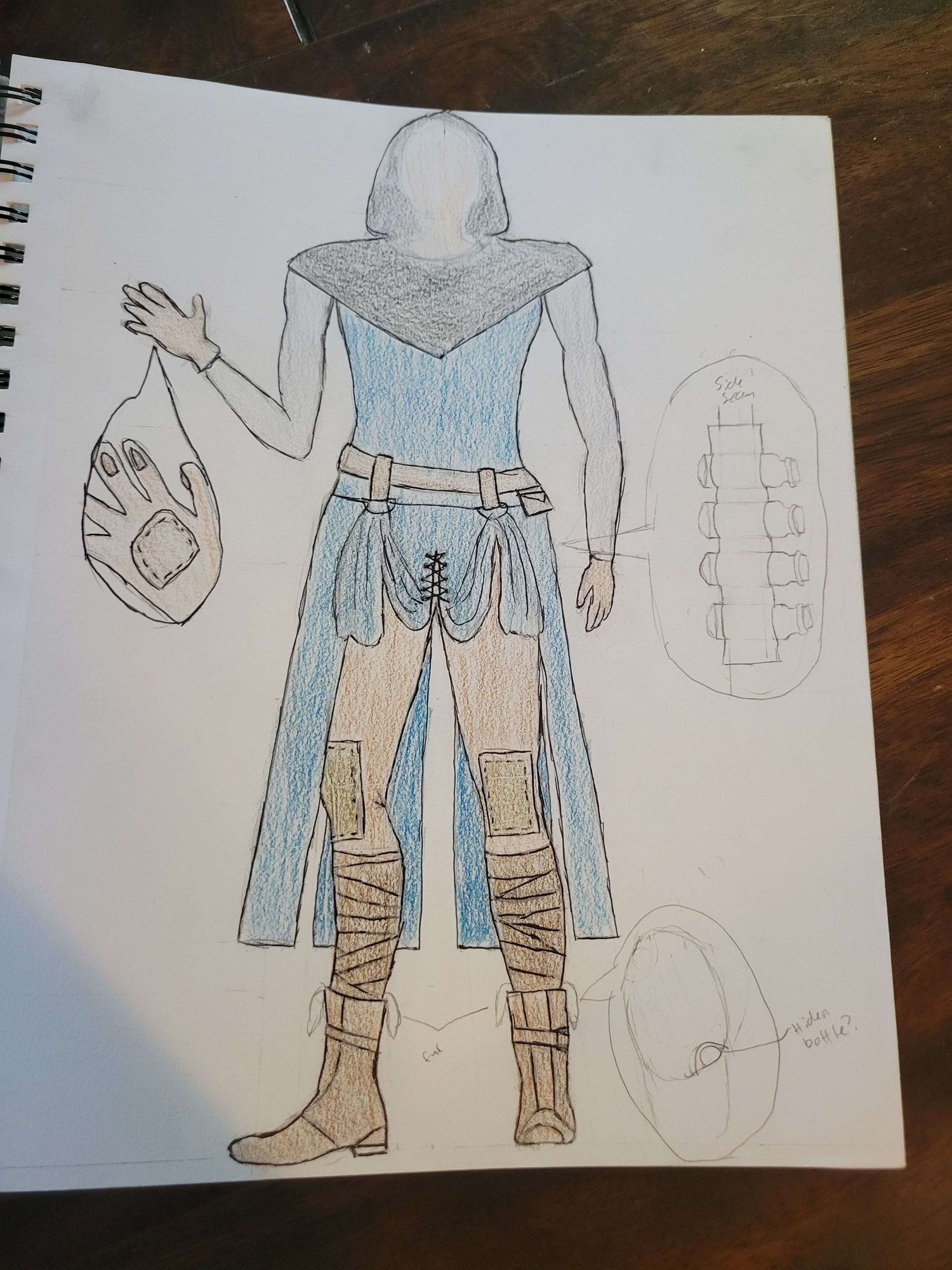 Rough pencil sketch of a character design showing outfit details with jacket and boots in light blue coloring.