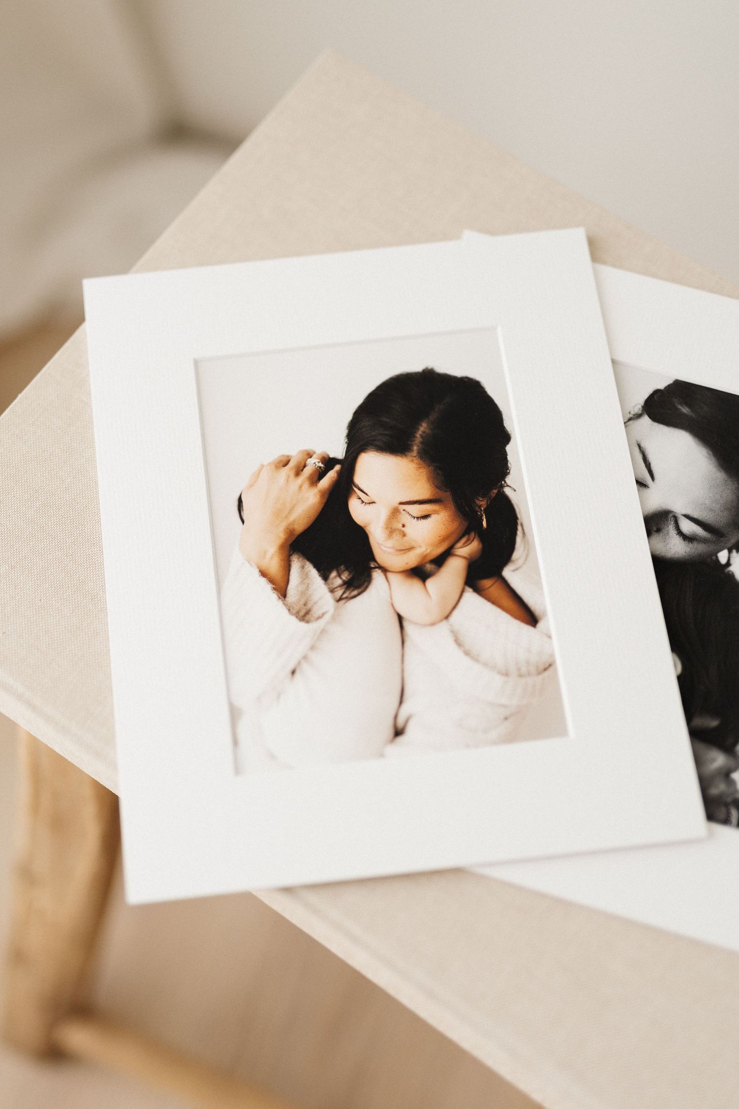 Series of intimate maternity portraits arranged on cream colored surface.