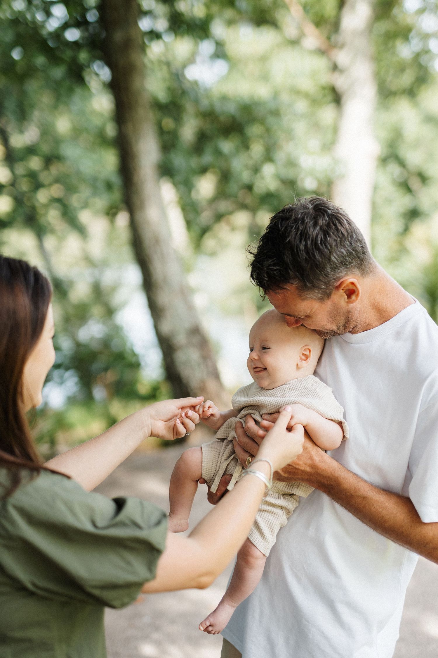 A tender moment captured in a series of photos showing affectionate gestures in an outdoor setting with soft natural lighting.