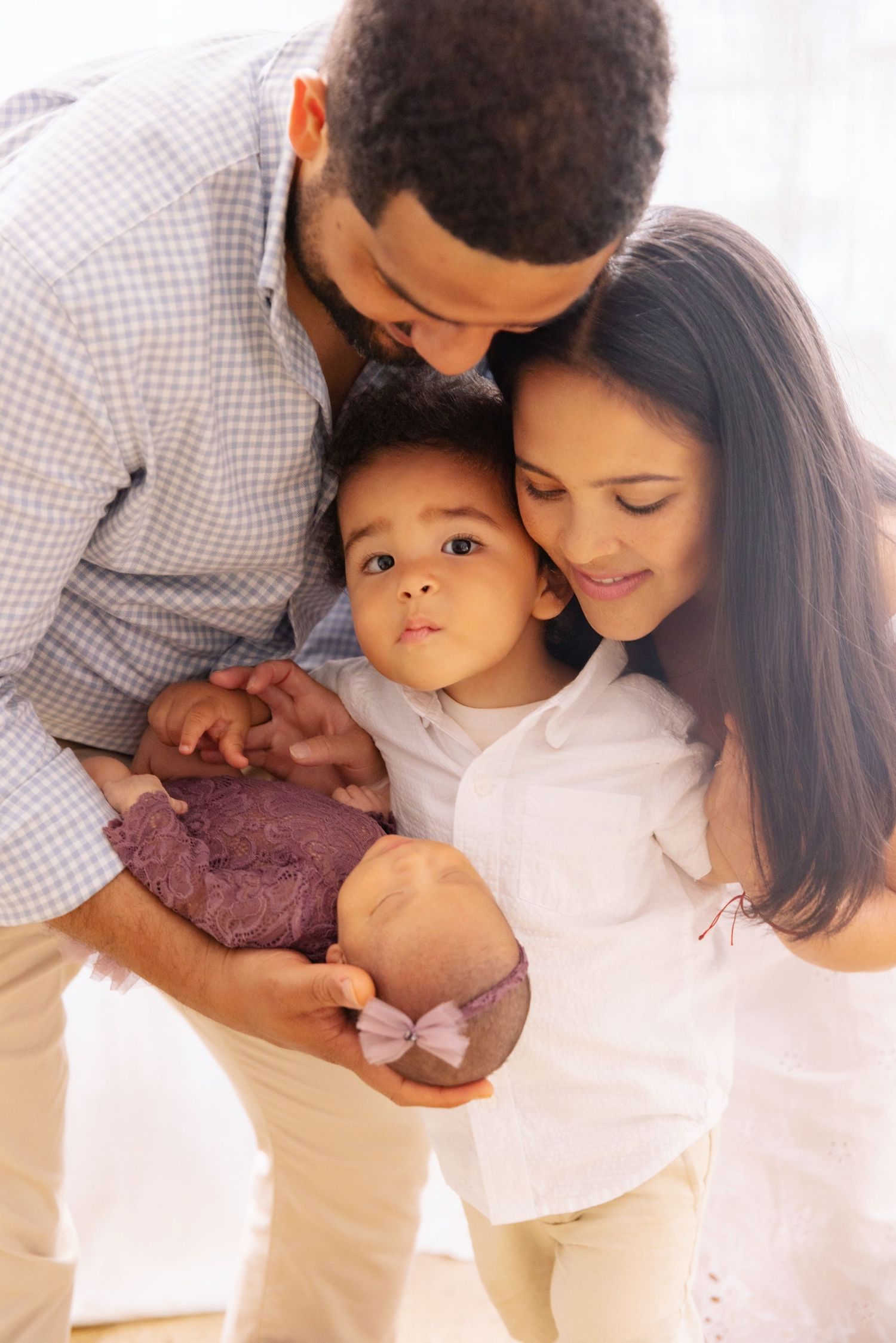 Lifestyle, candid family portraits in New York studio.