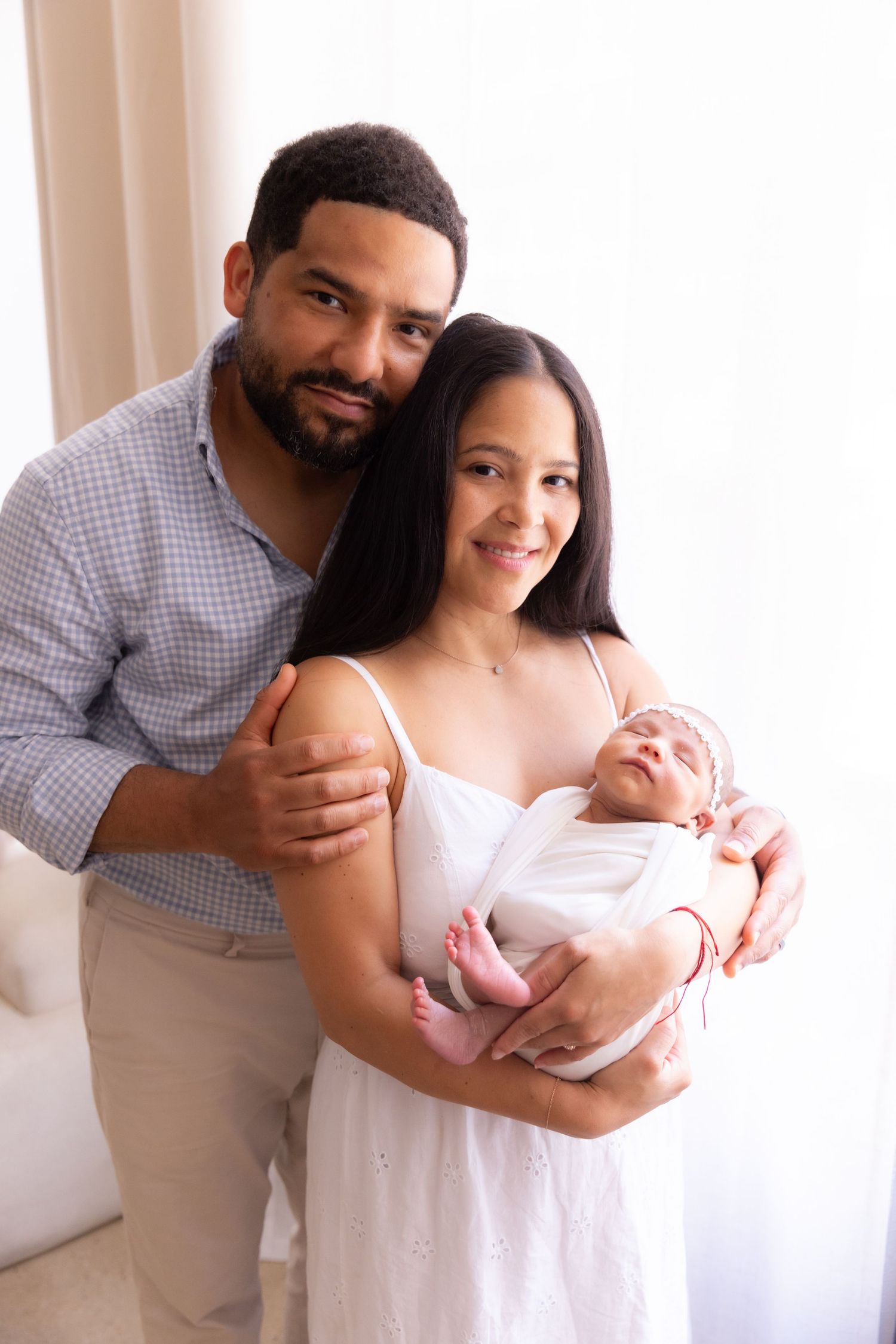 Lifestyle, candid family portraits in New York studio.