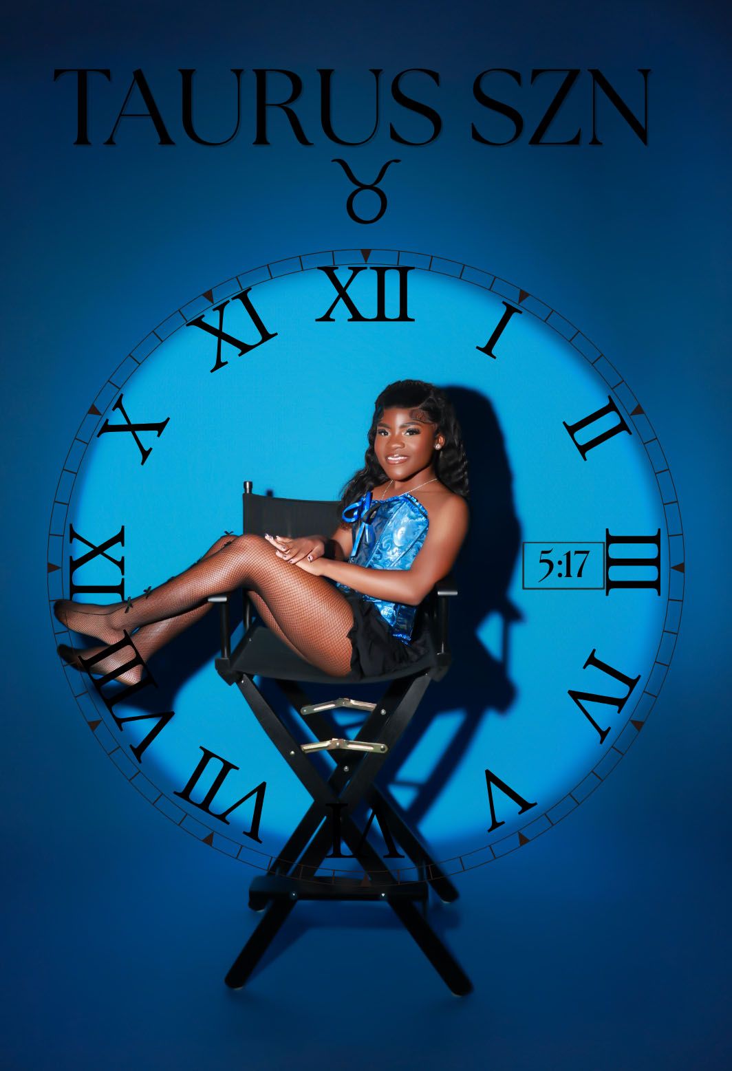 Woman in blue sequin top sits in director chair before large blue clock, Taurus SZN.