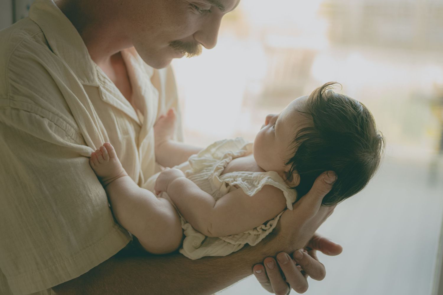Collection of romantic photos showing tender moments between a couple in soft, dreamy lighting.