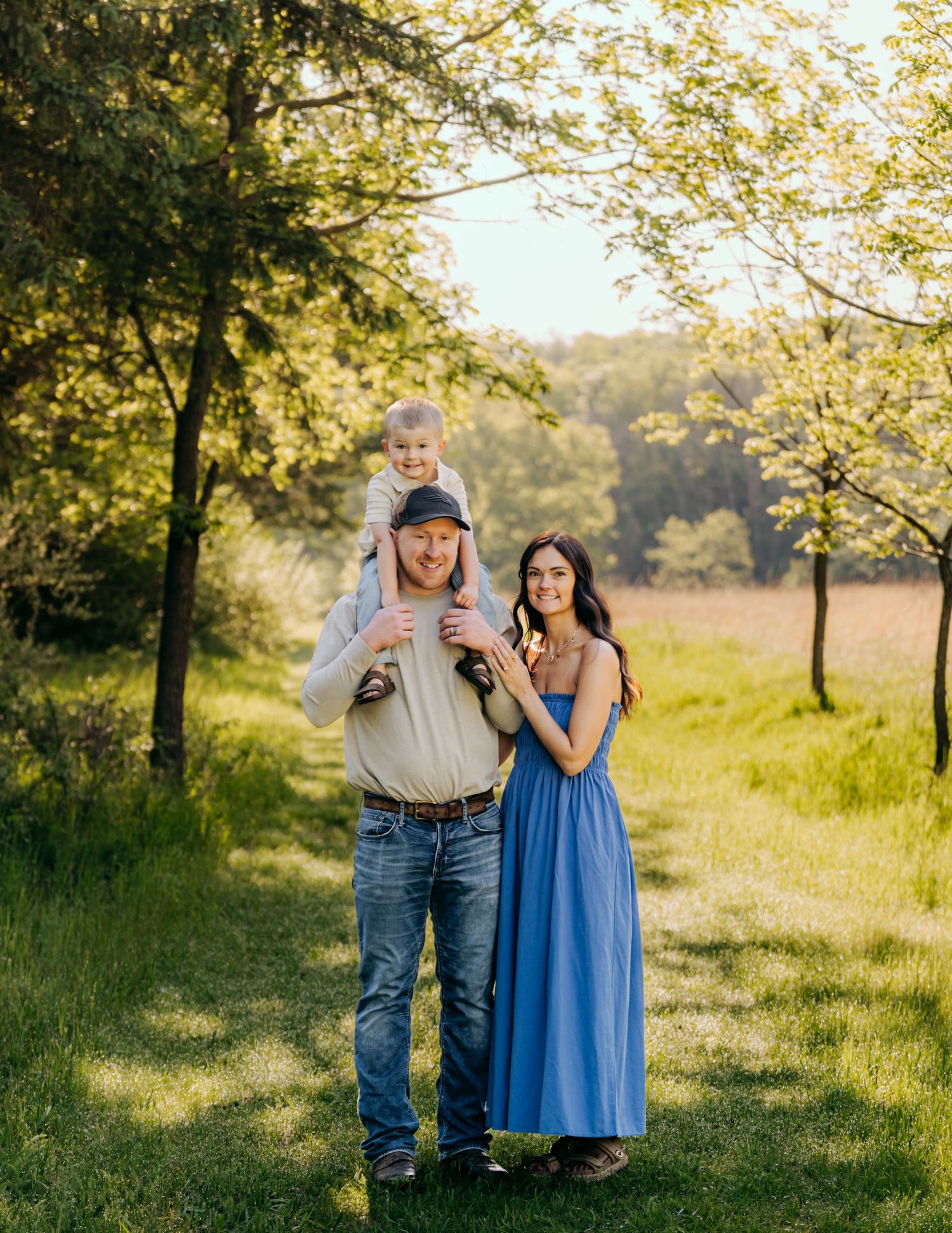Family portrait session outdoors near Pardeeville, Wisconsin. Natural light, candid moments, and posed moments during a family session.