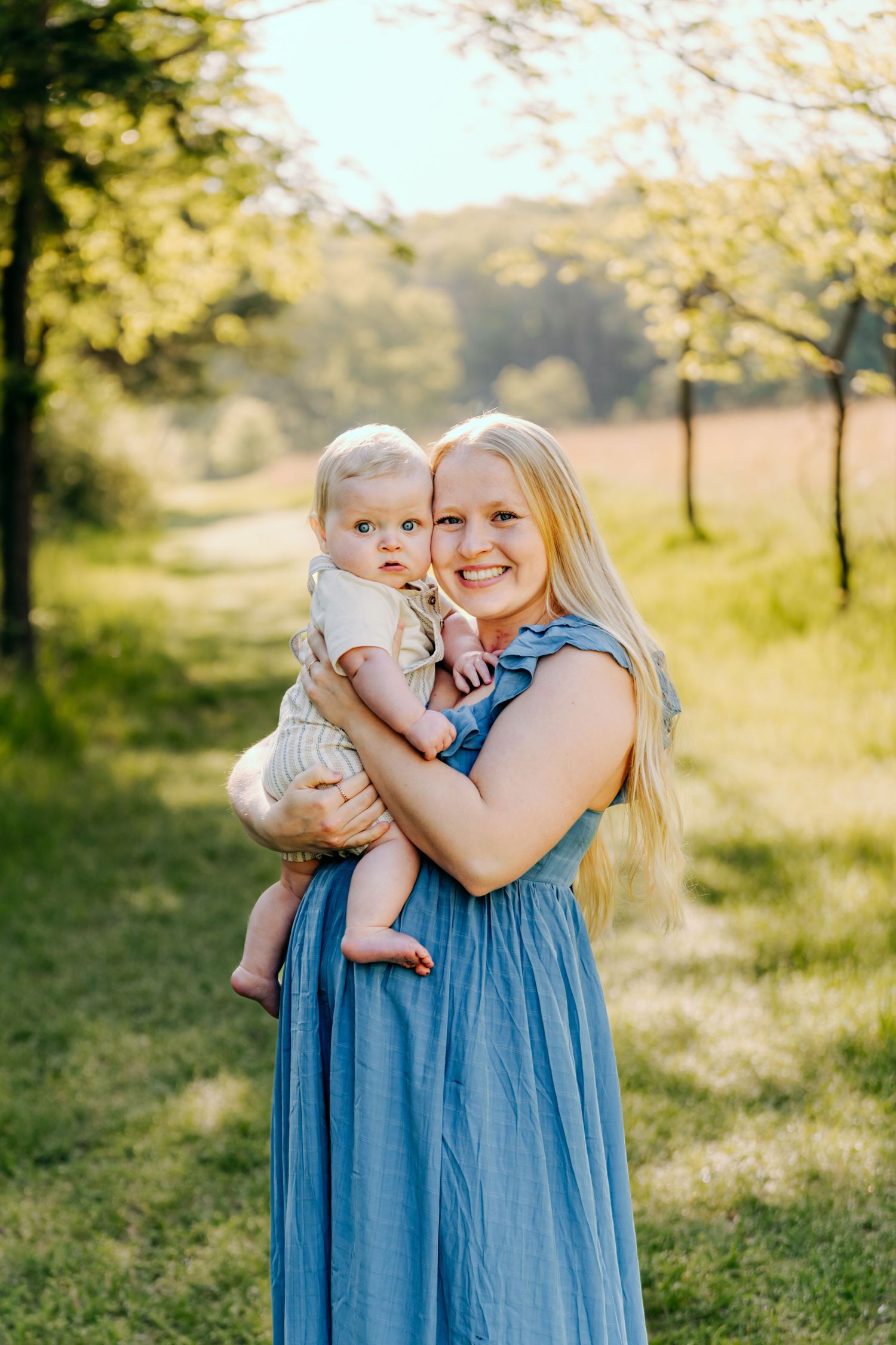 Family portrait session outdoors near Pardeeville, Wisconsin. Natural light, candid moments, and posed moments during a family session.