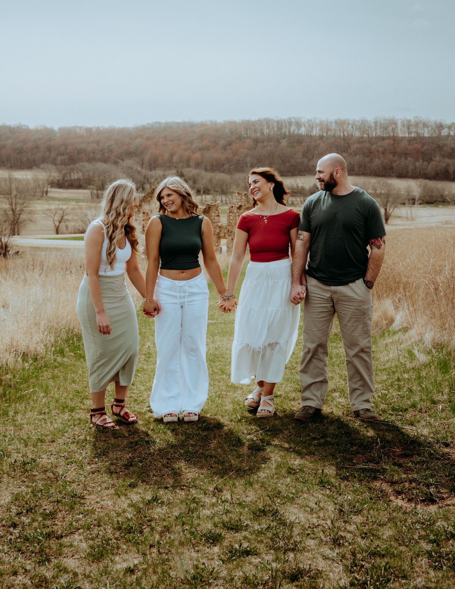 Family portrait session outdoors near Pardeeville, Wisconsin. Natural light, candid moments, and posed moments during a family session.
