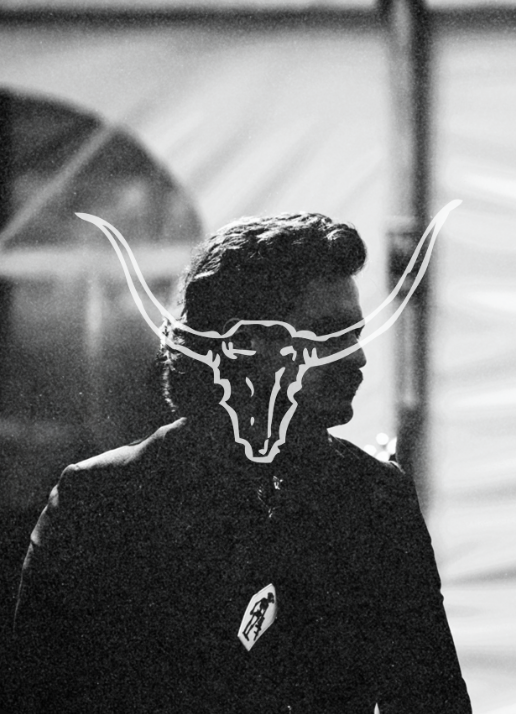 Artistic black and white portrait with bull horn overlay silhouette effect.