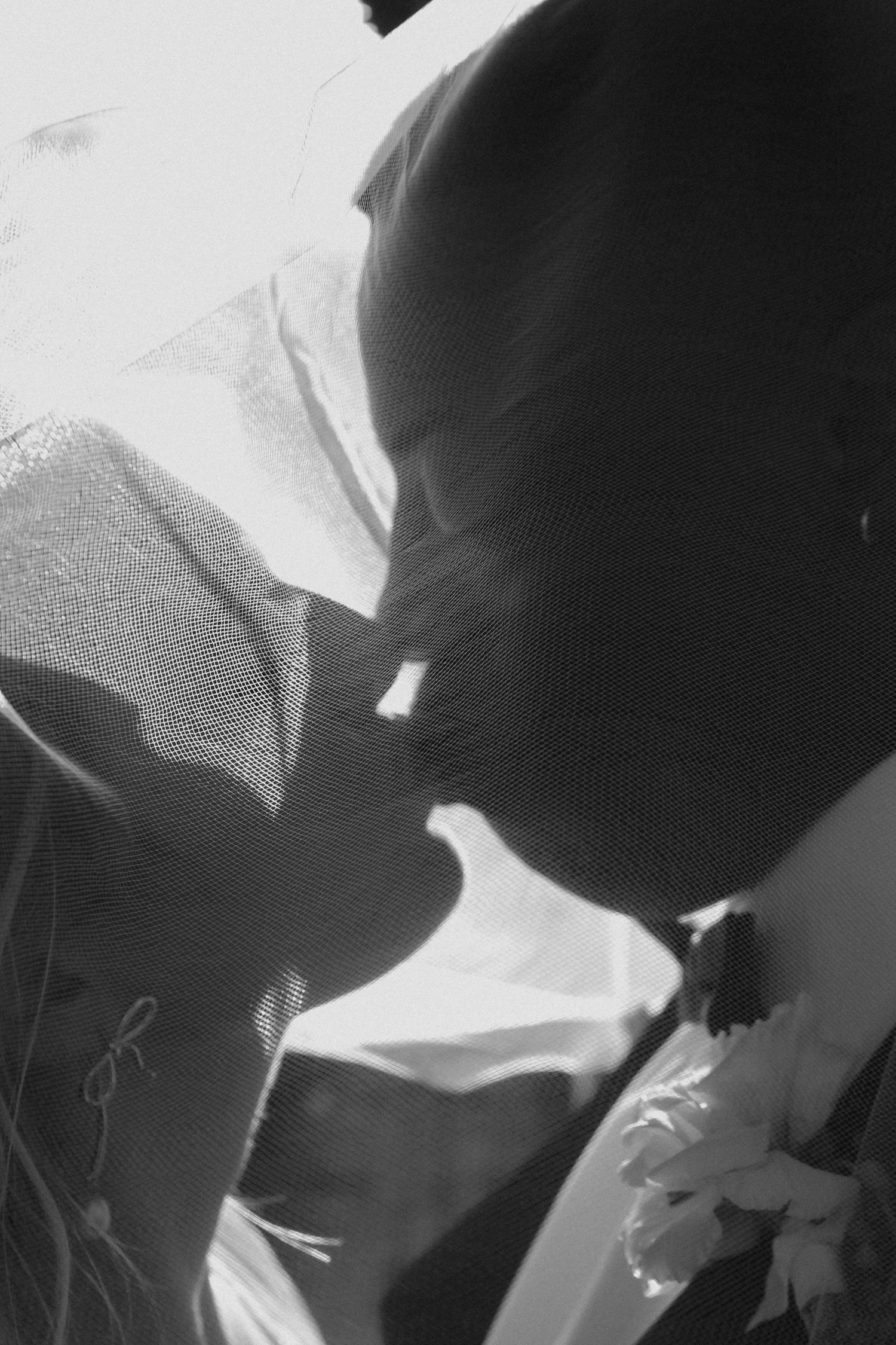 A black and white photo sequence shows silhouettes interacting in contrasting light and shadow formations.