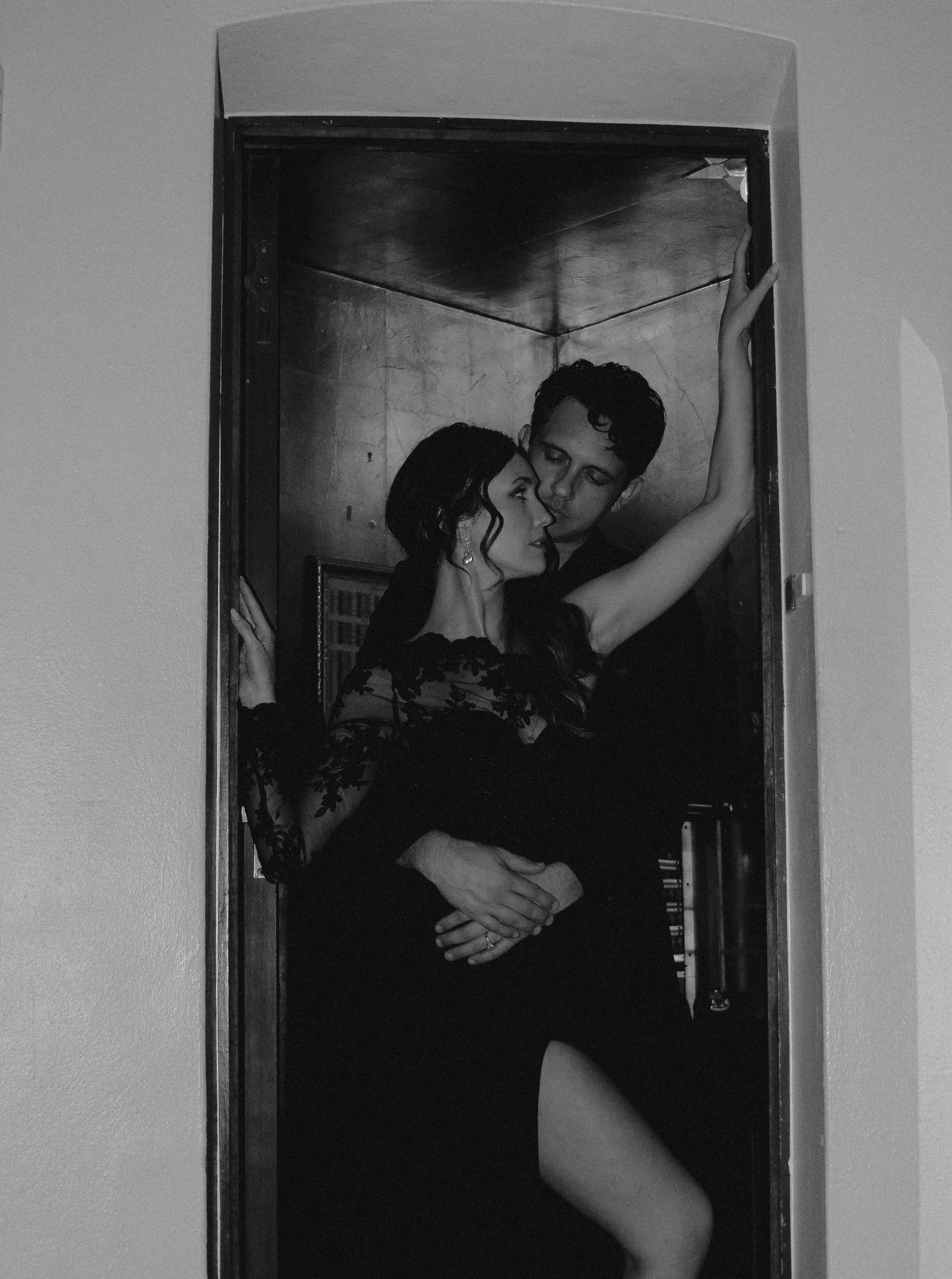 Artistic black and white sequence capturing intimate dance poses in doorway silhouette.