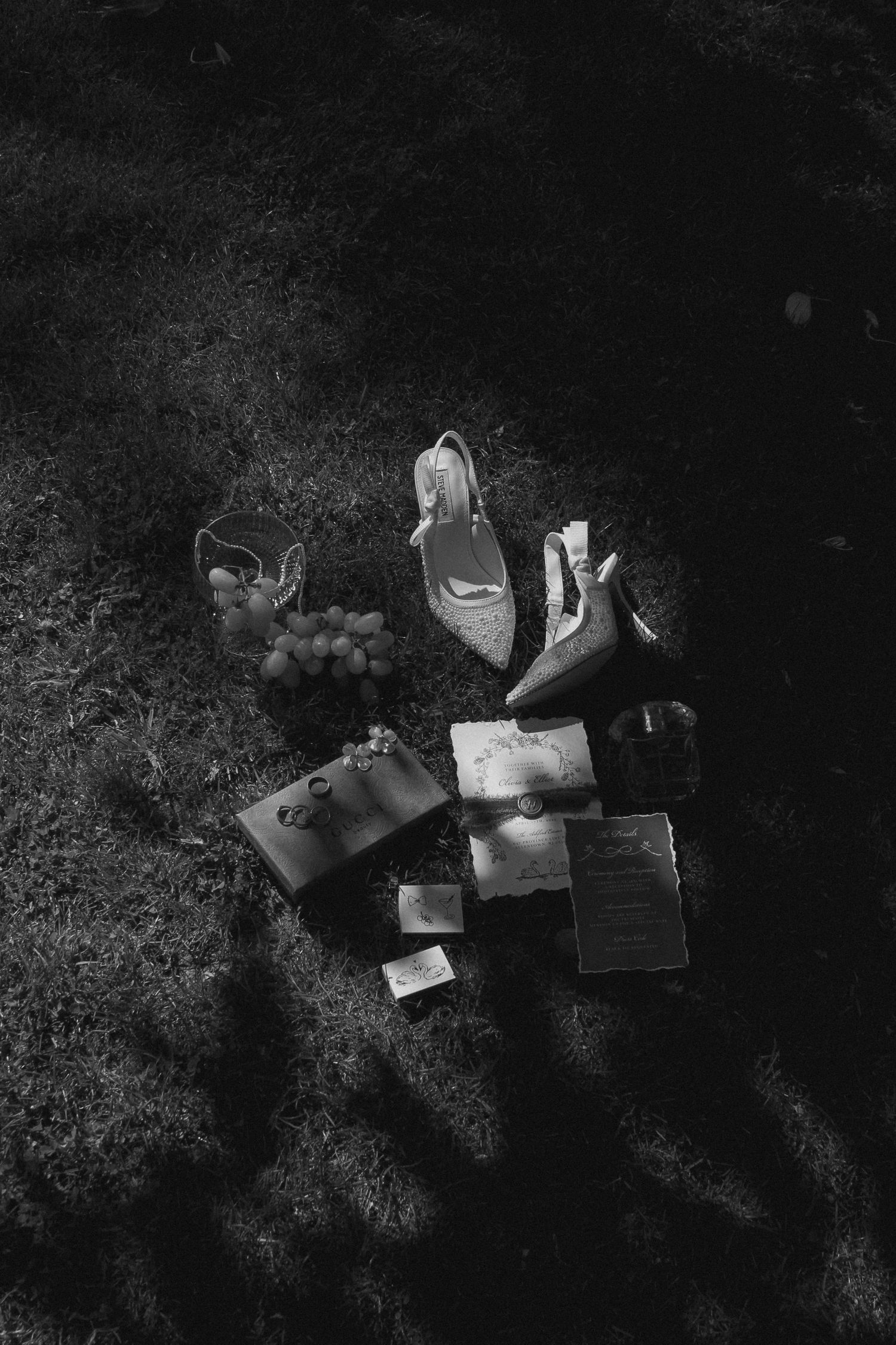 A sequence of black and white photographs showing books falling and scattering across a dark textured surface. Tyler Garlej Photography