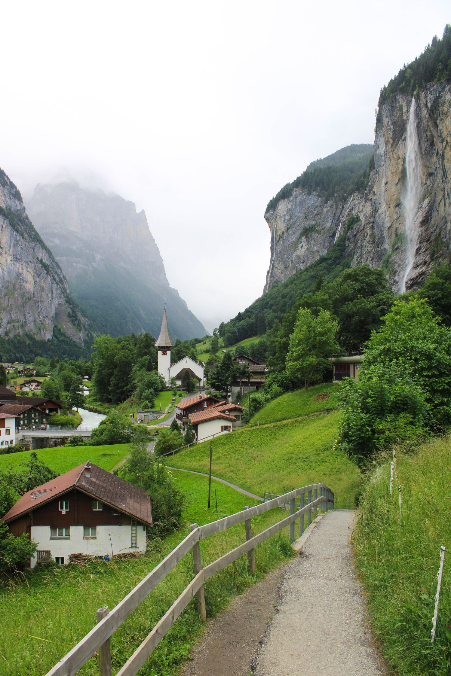 A waterfall on a misty day in Lauterbrunnen, Switzerland