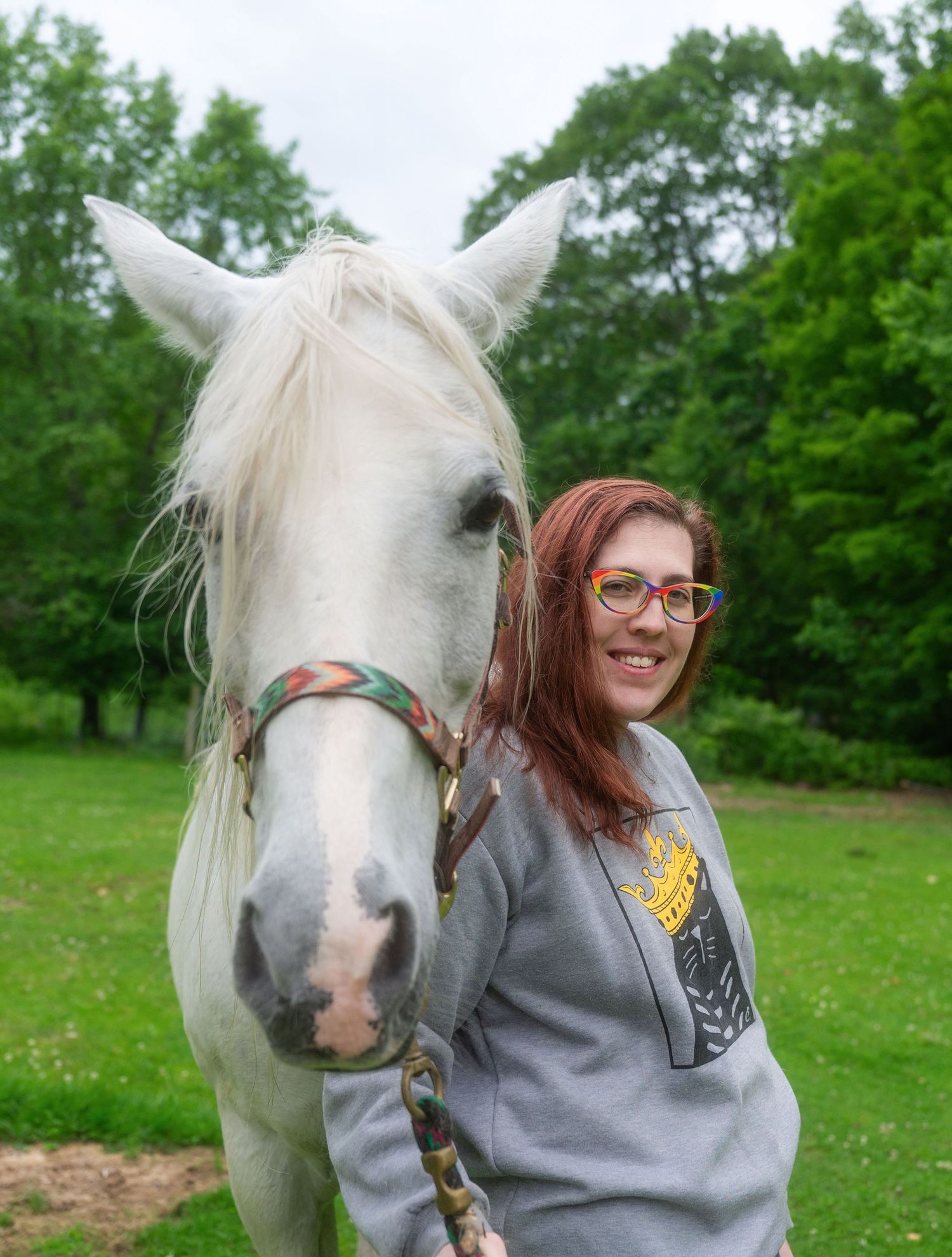 A woman posing with her horse with natural and true to color photography in Fitzwilliam, New Hampshire.