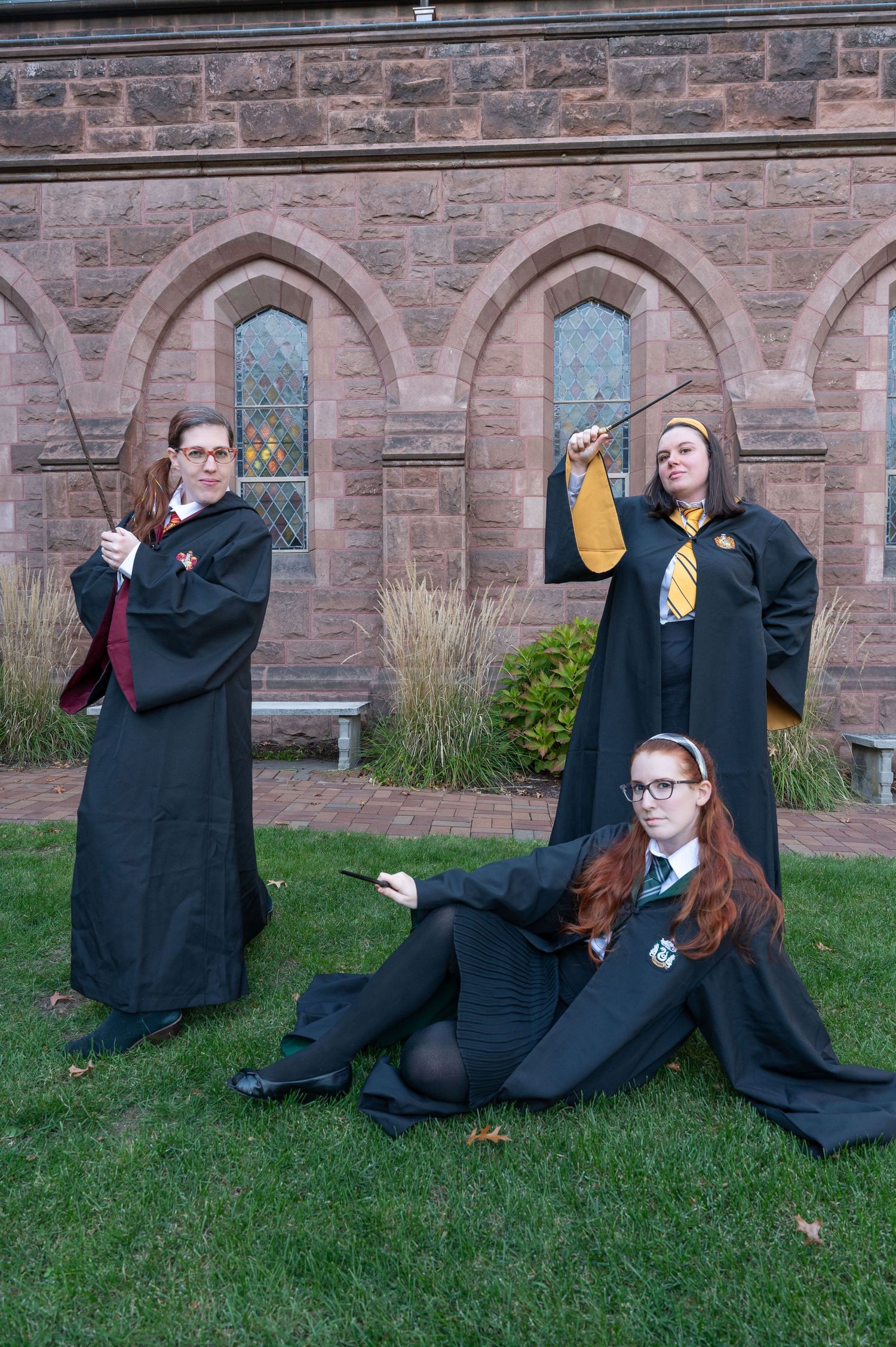 3 girls dressed as Hogwarts students from Harry Potter pose for a true to color photo at Mt. Holyoke College.