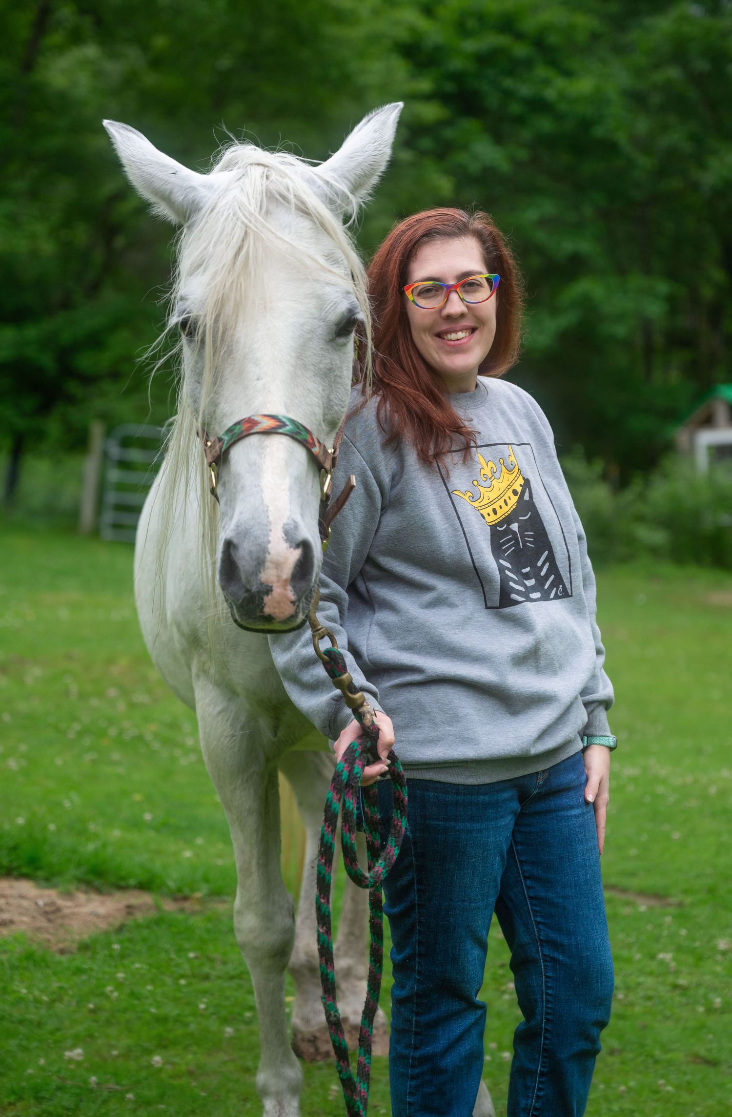 A woman posing with her horse at a farm in Fitzwilliam, New Hampshire