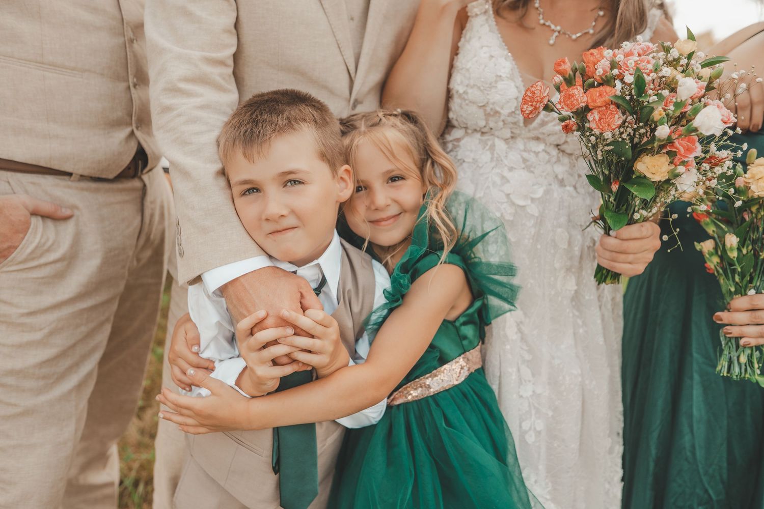 Wedding photography in Littleton, New Hampshire capturing a flower girl and ring bearer during golden hour portraits.