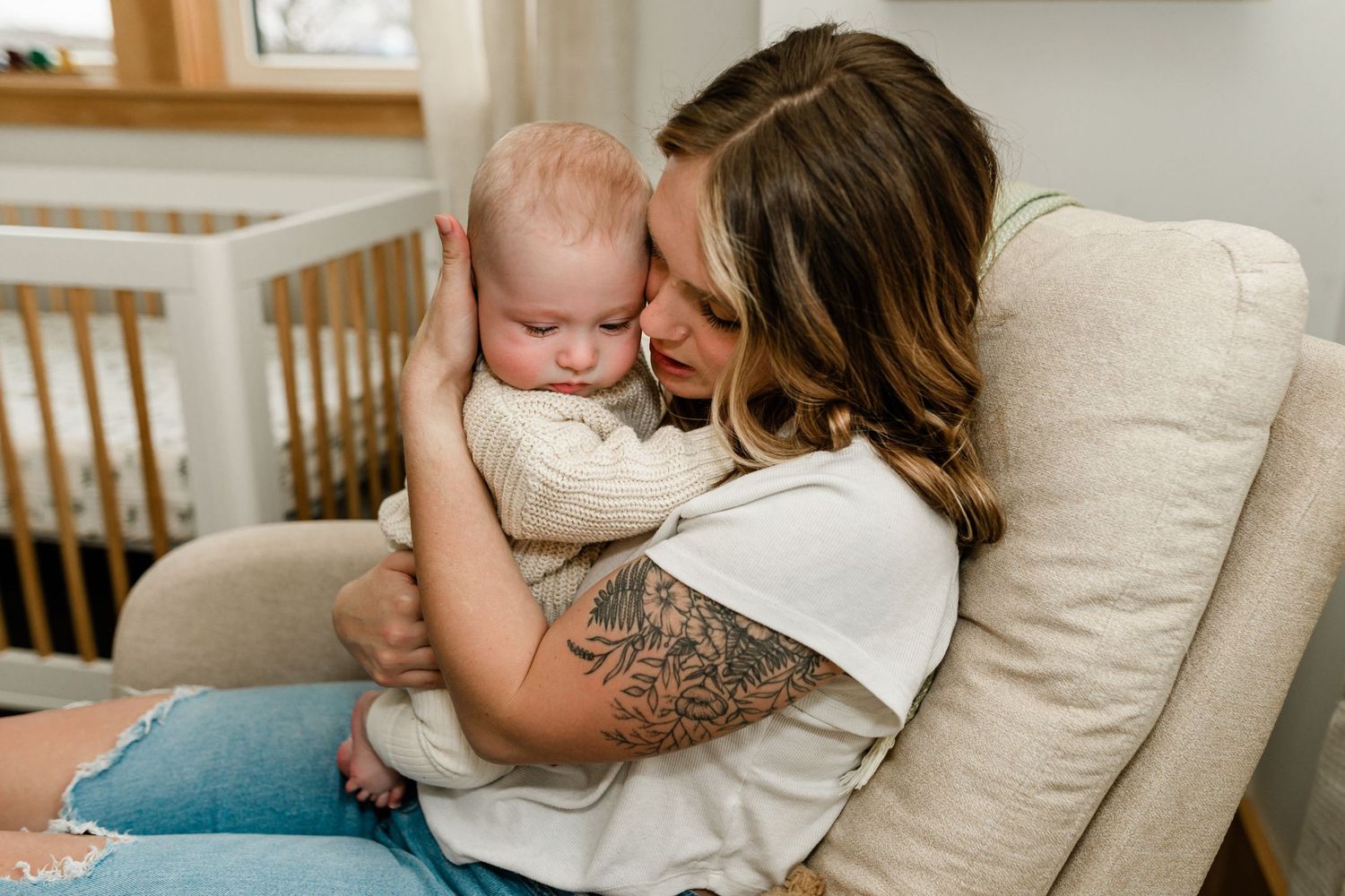 Motherhood photography in Littleton, New Hampshire capturing a motherhood in natural light during an home portrait session.
