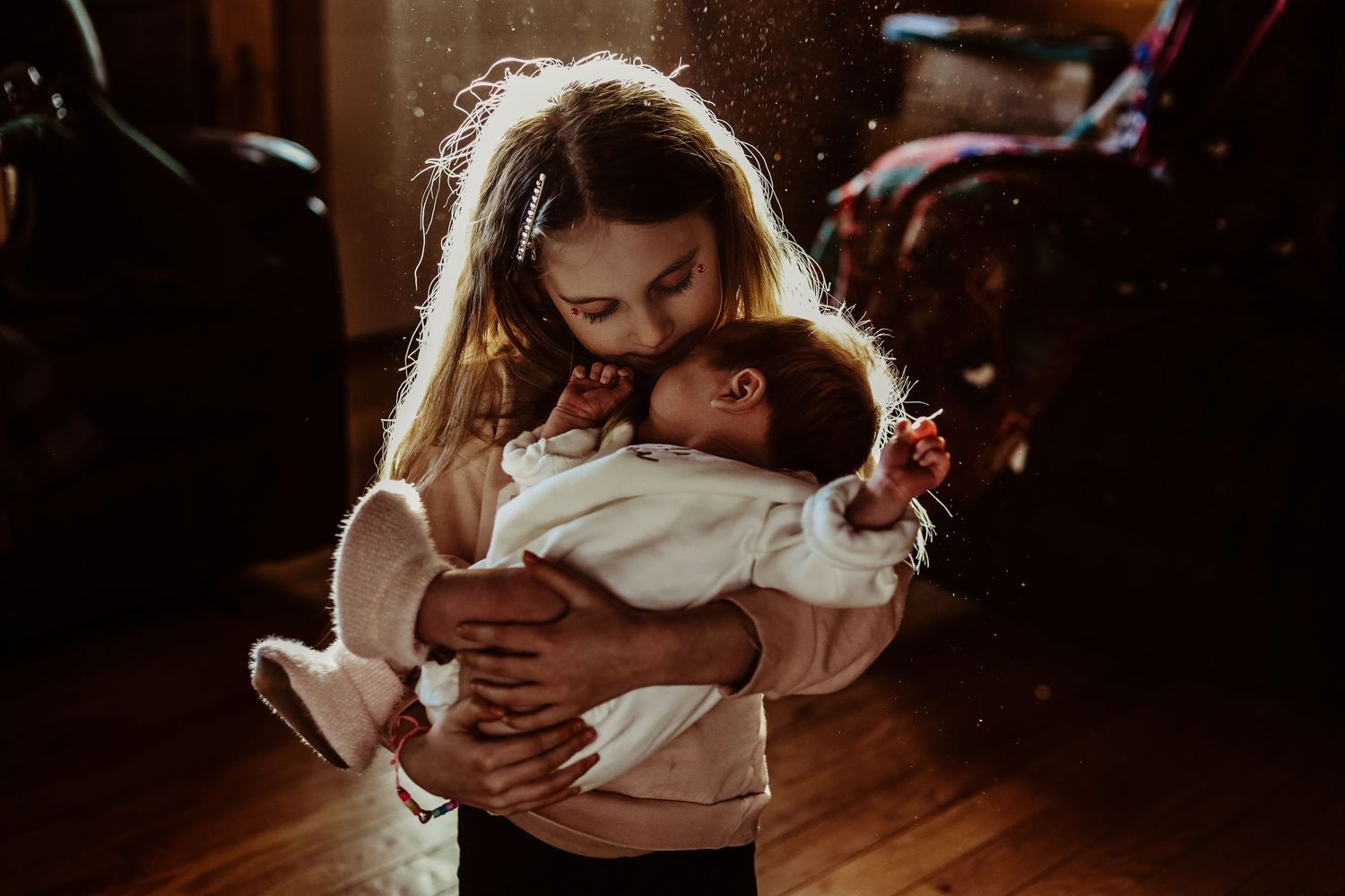 Tender moment captured in warm light showing care and connection.