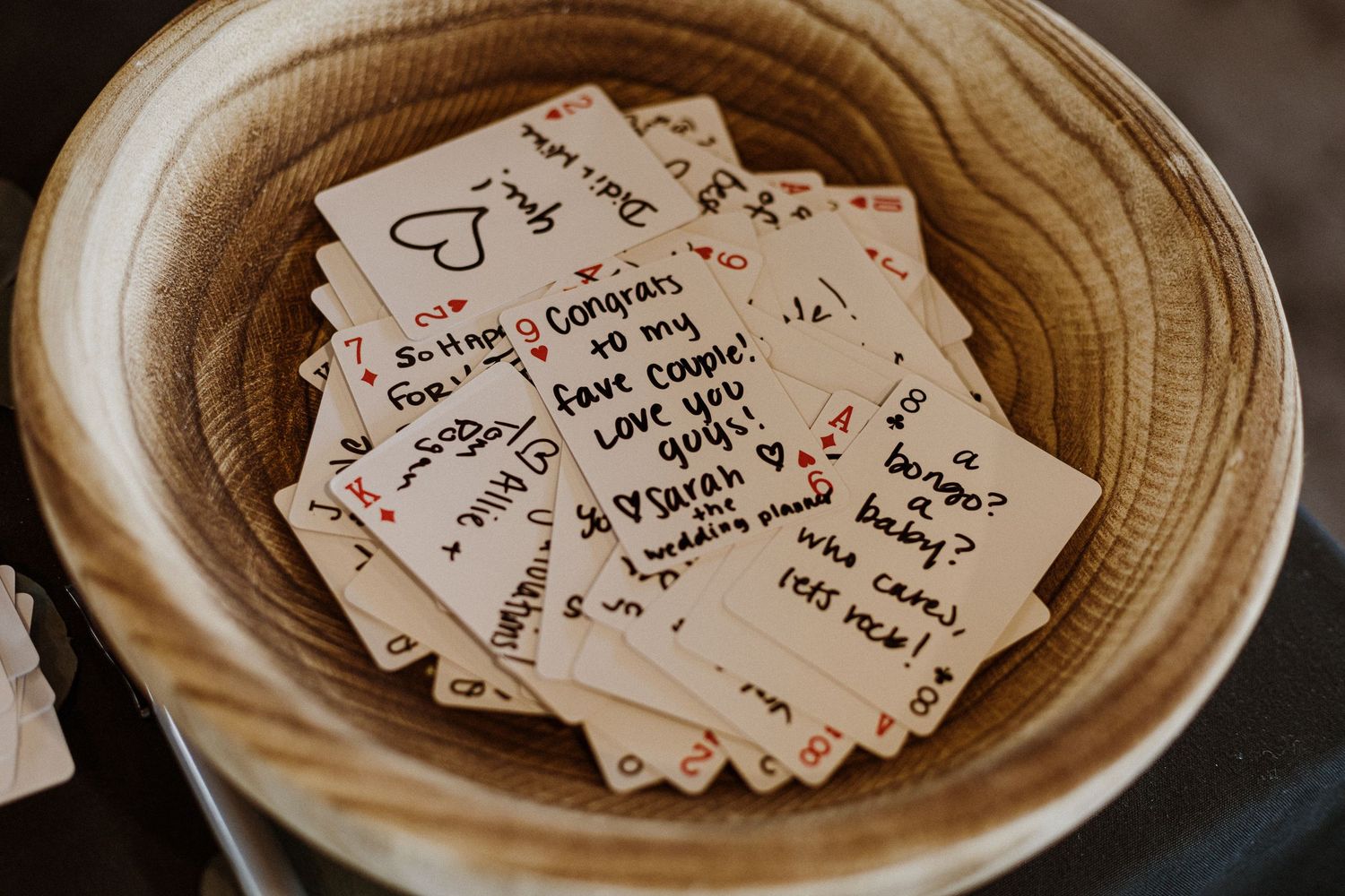 Handwritten notes and messages collected in a light-colored woven basket.