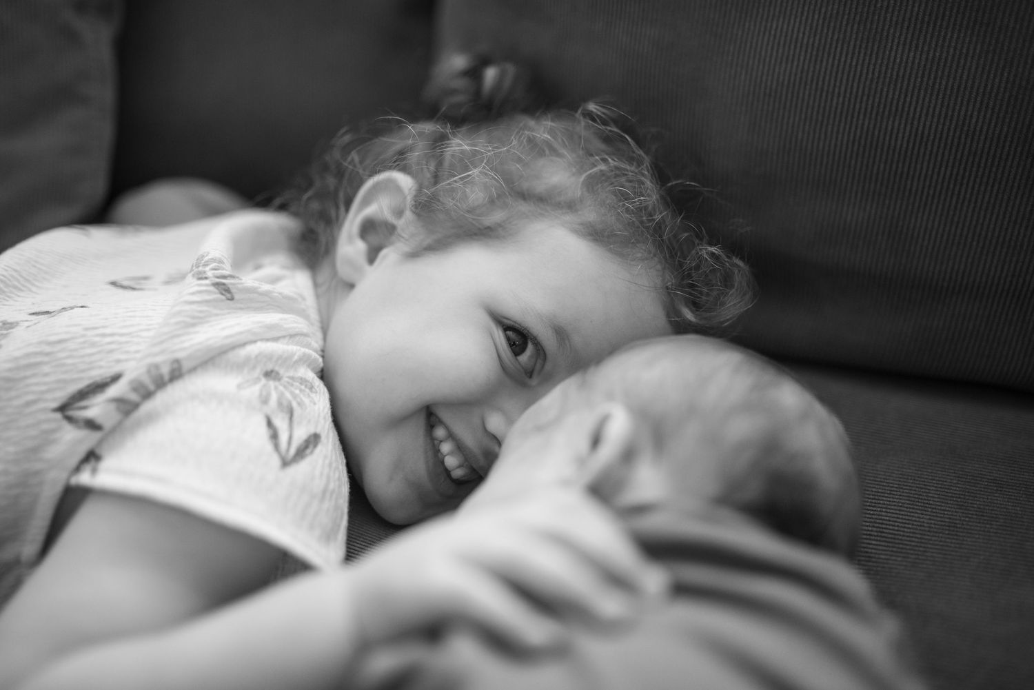 toddler smiling, newborn
