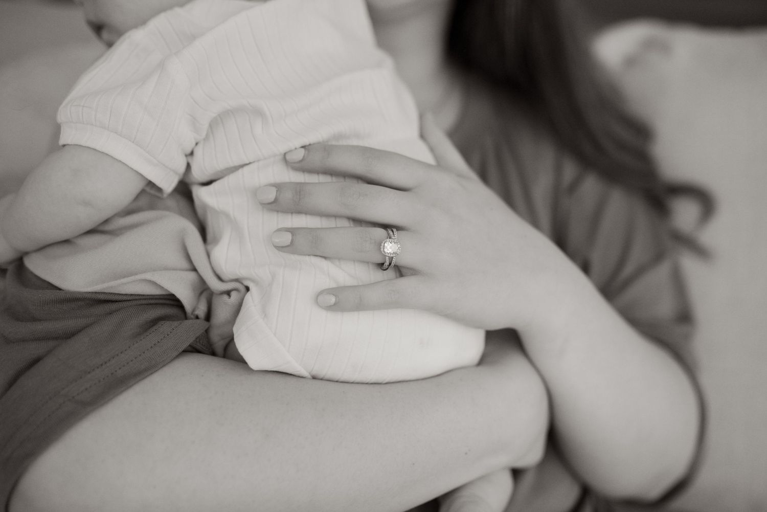 hand resting on newborns back