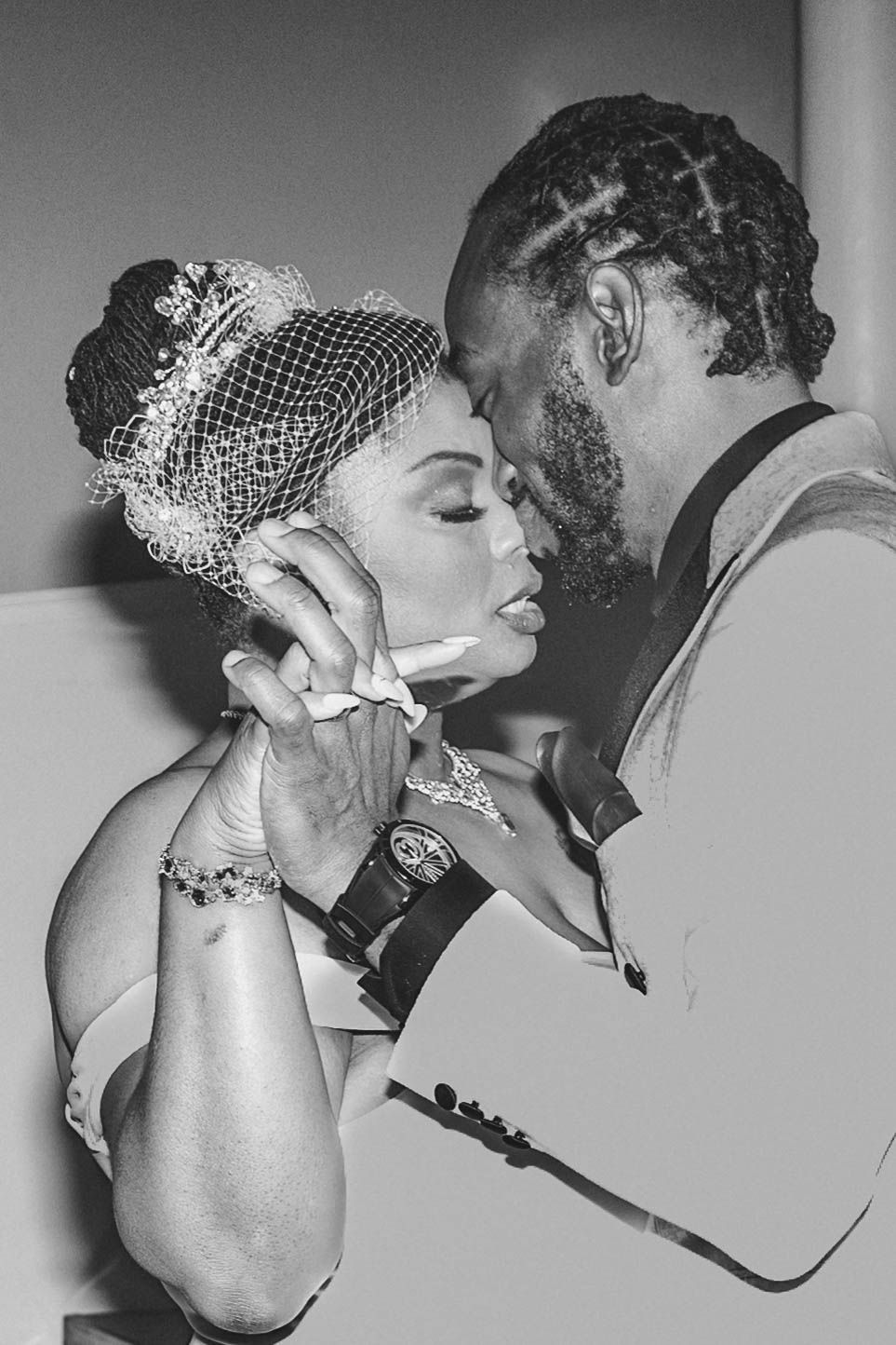 Black and white photo series showing a romantic couple in vintage 1950s style embracing and kissing.