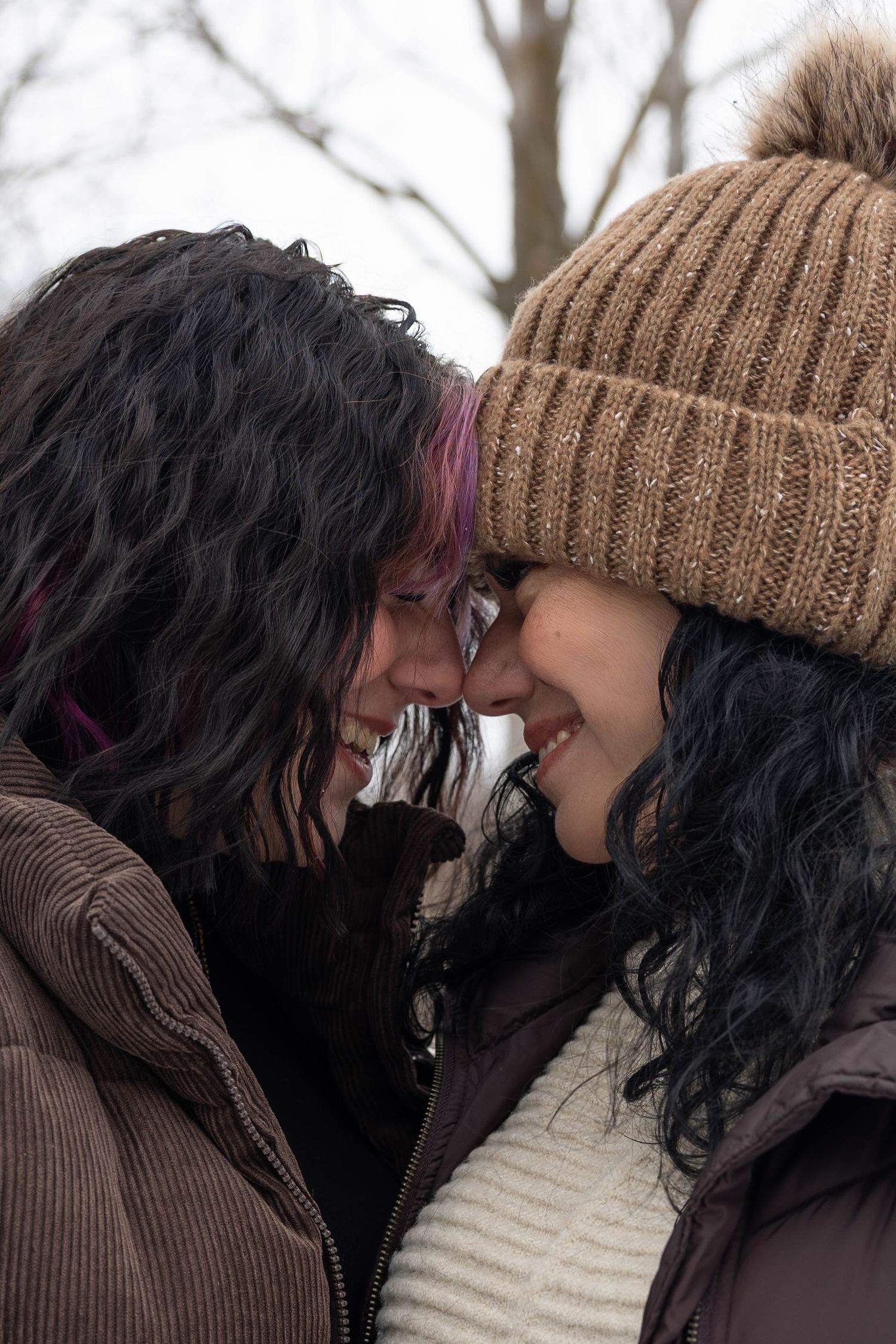 A romantic close-up sequence showing a couple in winter attire sharing intimate moments.